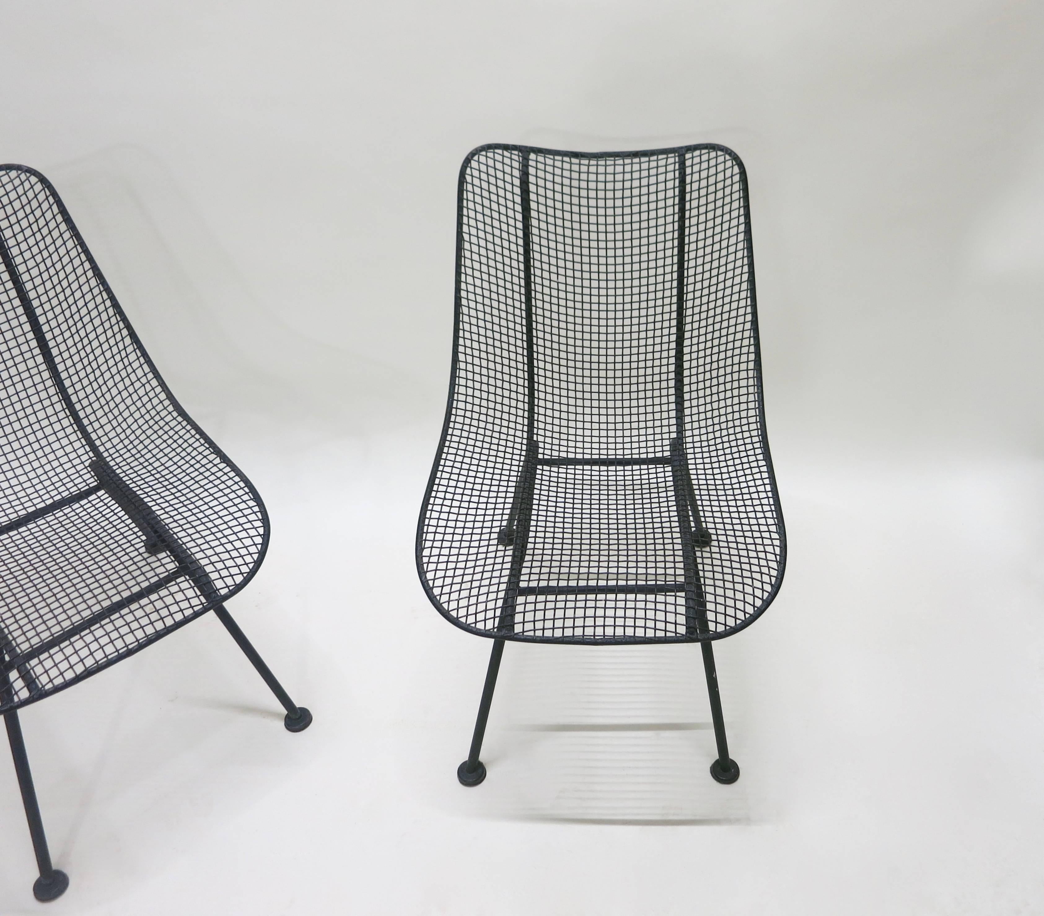 Four vintage, outdoor armless dining chairs from Woodard's 'Sculptura' line, powder coated in a matte charcoal grey-black finish. All four in excellent condition.
