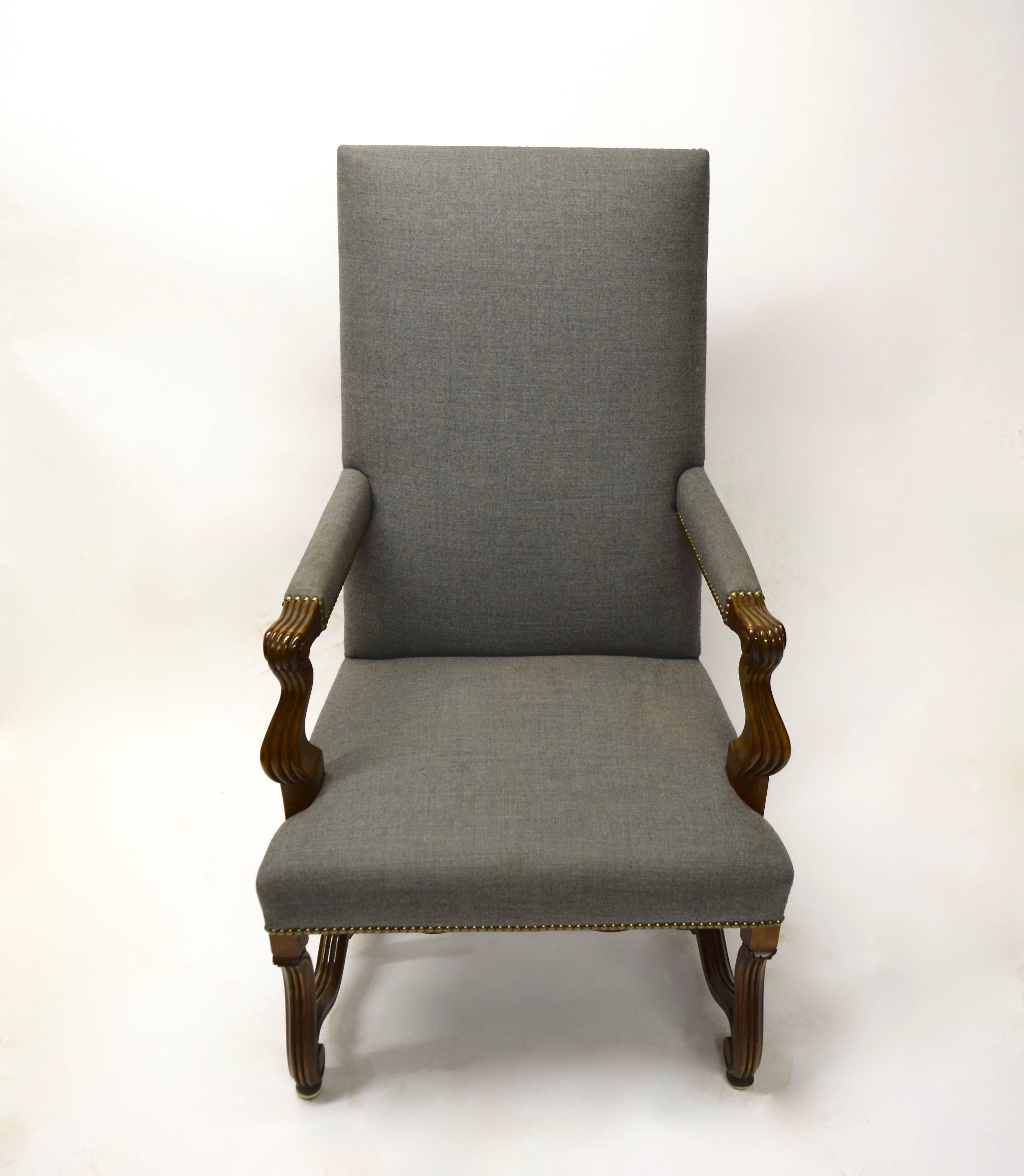 Two-arm and eight armless custom-made, high back dining chairs with carved mahogany legs and arms, brass nail heads, and upholstered in grey fabric. All chairs are in excellent condition and the fabric is without any holes or rips.

Armless Chair