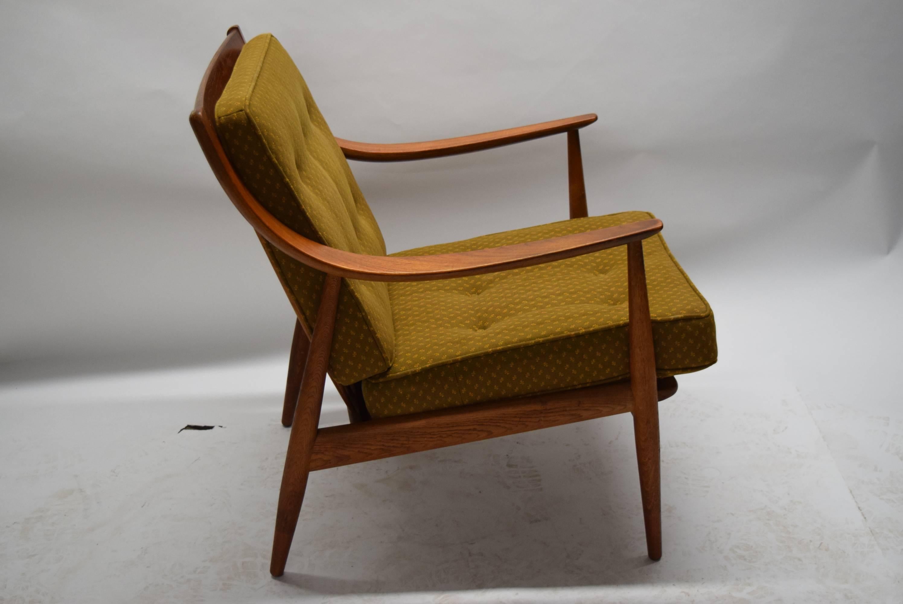 Lounge chair by Ib Kofod-Larson has original straps and cushions. The finish also original has no dings scratches dents. The cushions have no tears with little wear but nothing worn through.