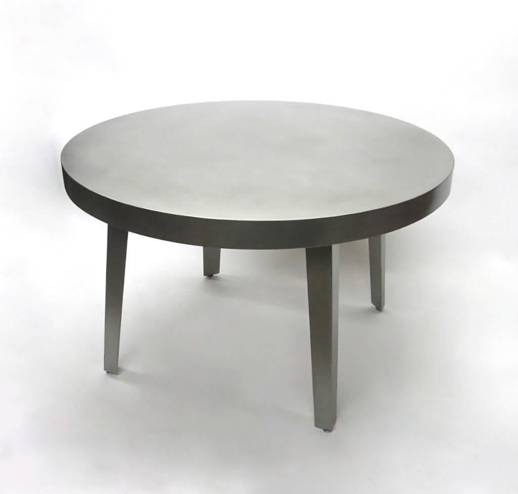 Round dining or center table of strong quality in brushed stainless steel with a 3 1/8