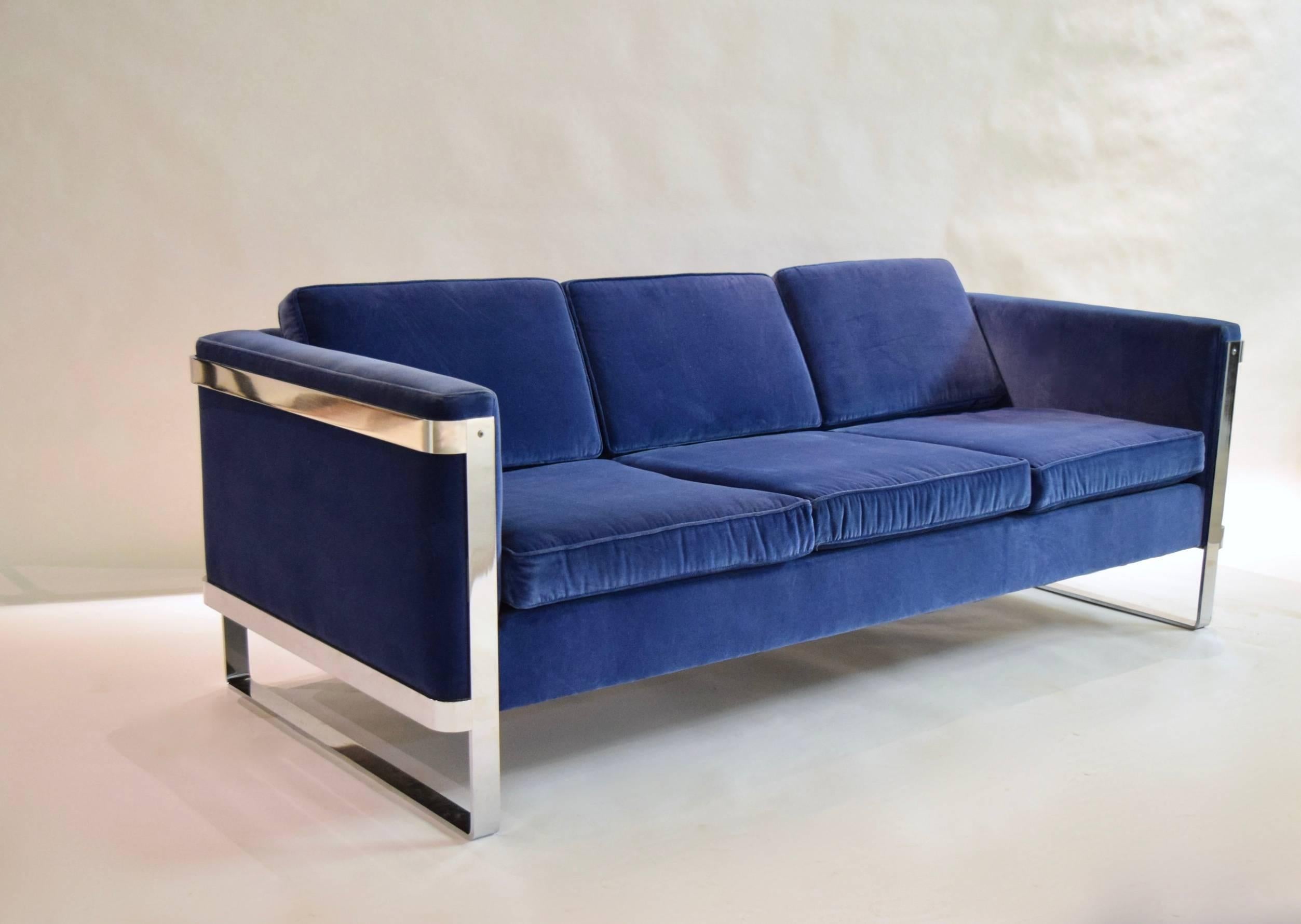 Pace collection three-seat sofa with a solid, polished steel frame and recently upholstered in blue velvet. Arm height measures 25.5