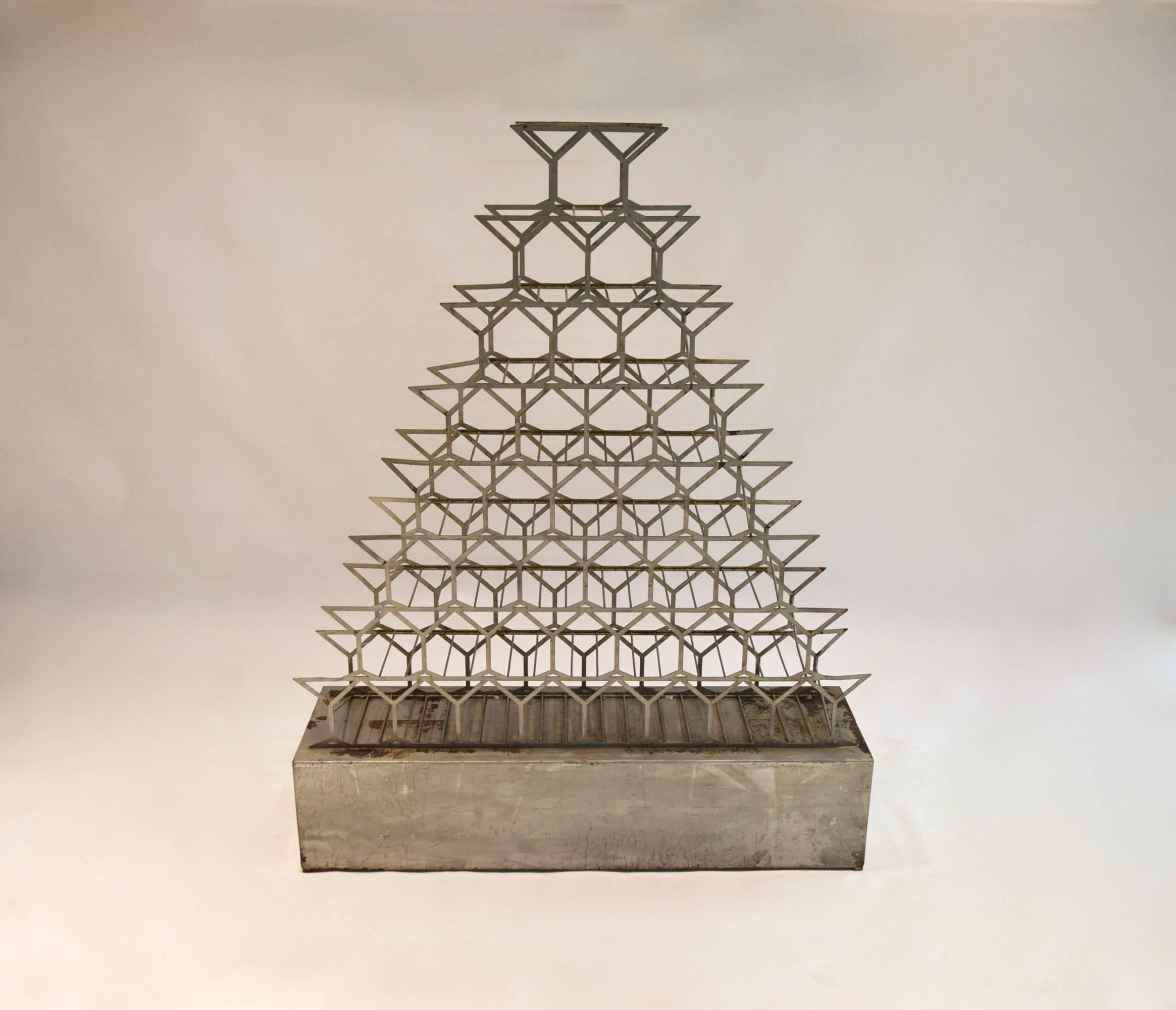 Free  standing wine rack in galvanized steel with 44 stacked champaign glasses on both sides that support each bottle. in very good, original condition.