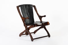 Silla de salón plegable de palisandro y cuero negro de mediados de siglo por Don Shoemaker