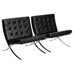 Pair Mid Century Black Leather Barcelona Chairs Mies van der Rohe for Knoll 1977