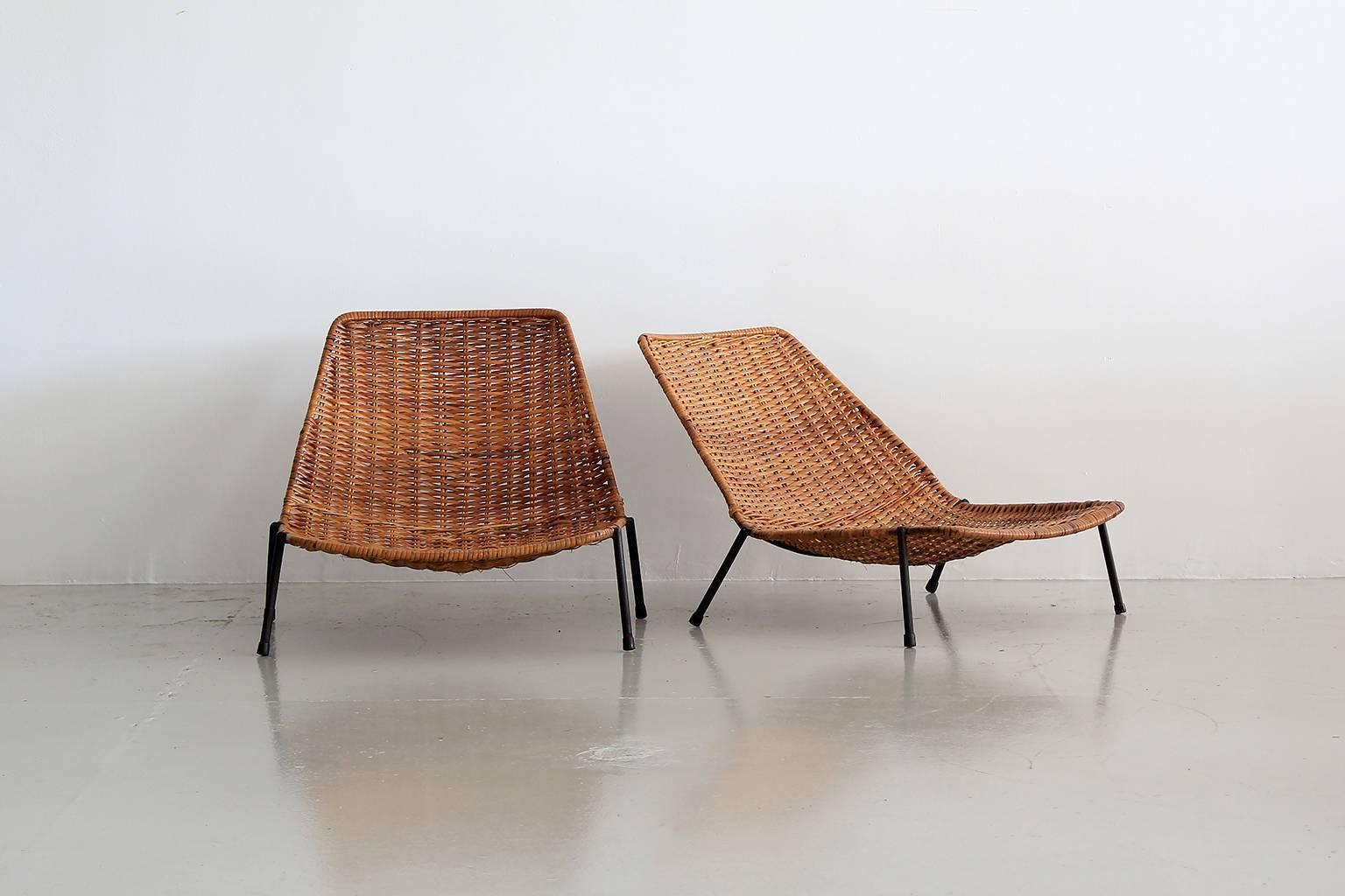 Unique pair of woven wicker pool chairs with iron base in the style of Carlo Graffi.
Great scale and low to the ground. Perfect for lounging by pool or perhaps a kids room!
       