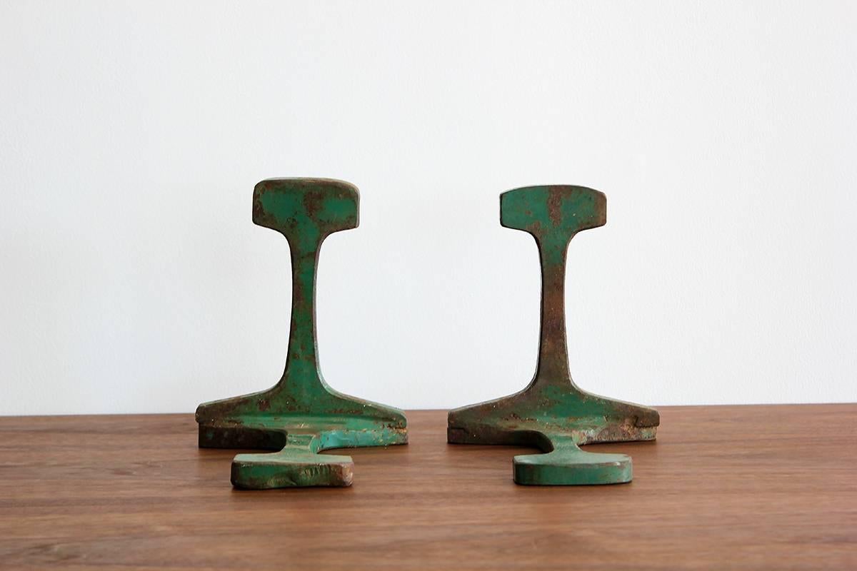 Set of bookends are made from an original railroad track and have fantastic patina and color. Super heavy iron!
 