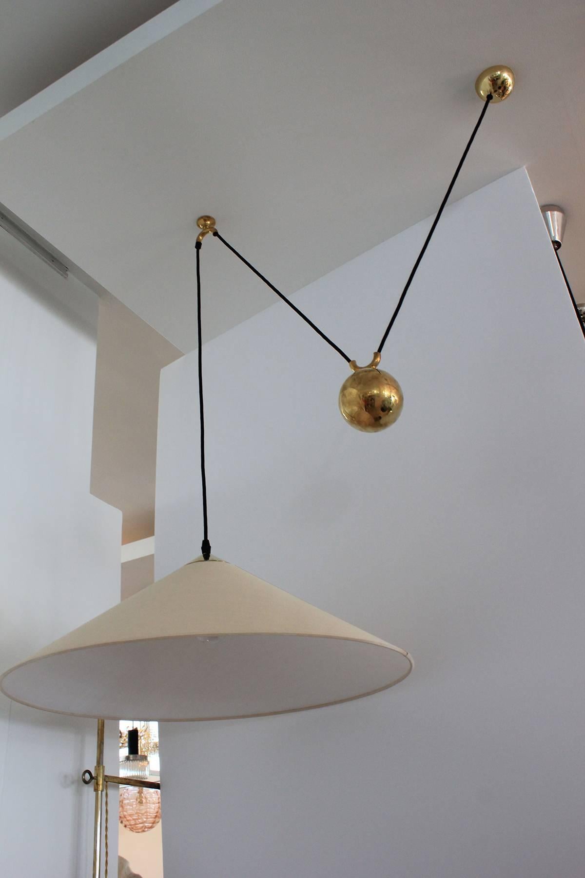 Florian Schulz pendant with counterbalance brass ball with new white silk shade. Newly rewired with black silk cord.
