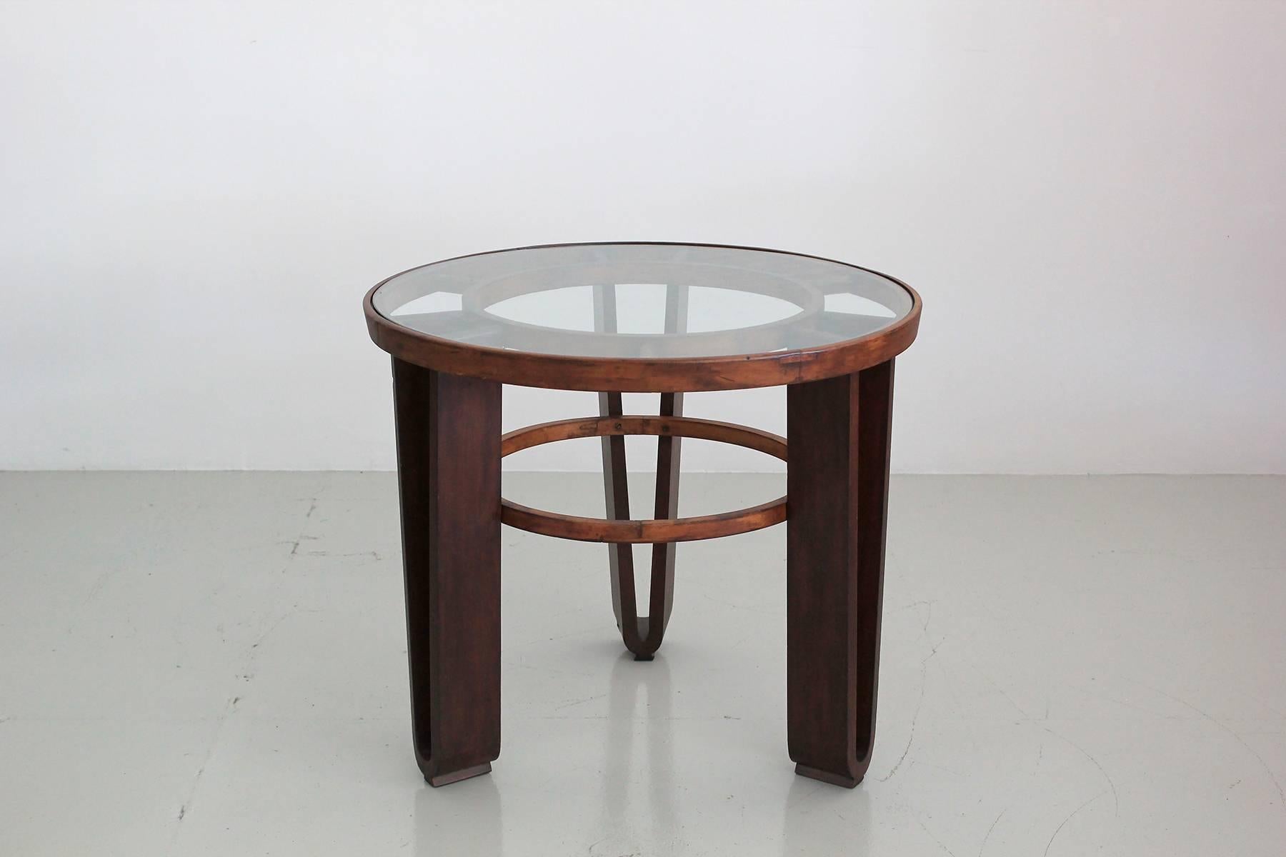 Gorgeous 1940s Italian table constructed entirely of different Italian woods. Including nutwood. 
Wonderful deco design with glass top.