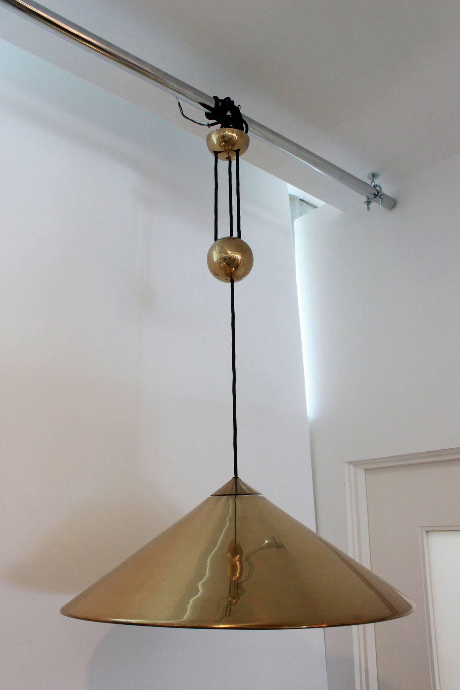 Brass Florian Schulz pendant with counterbalance brass ball. 
Newly rewired.