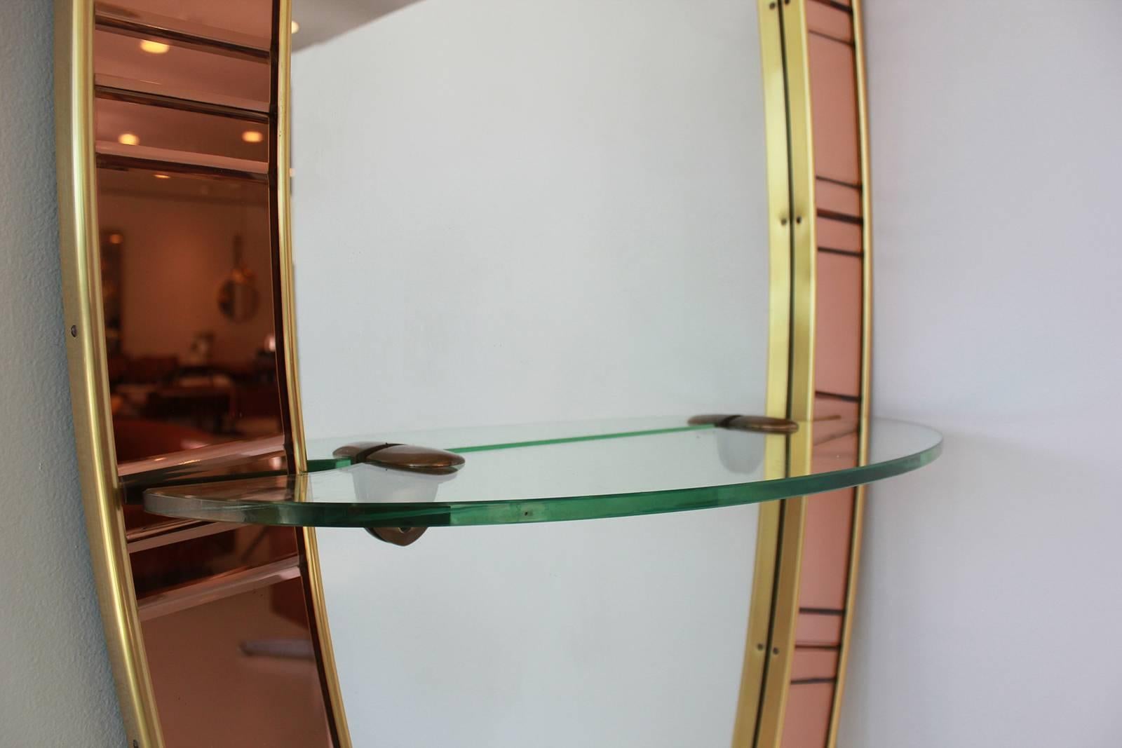 Crystal art mirror with copper colored glass, brass and mirror.
Full length in size with glass shelf.