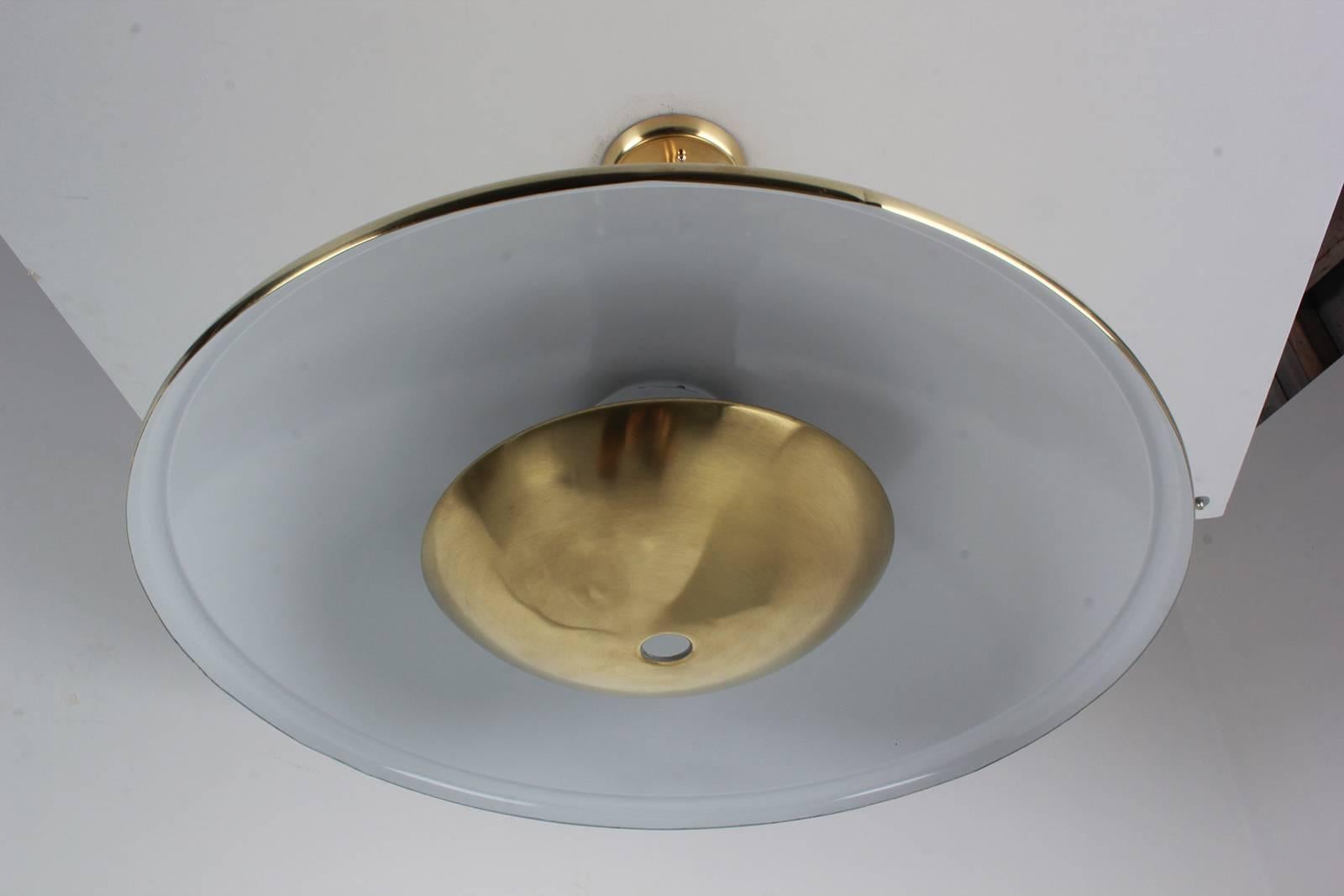 Simplistically designed brass dome pendant with brass reflector.
Newly rewired.
Great design.
