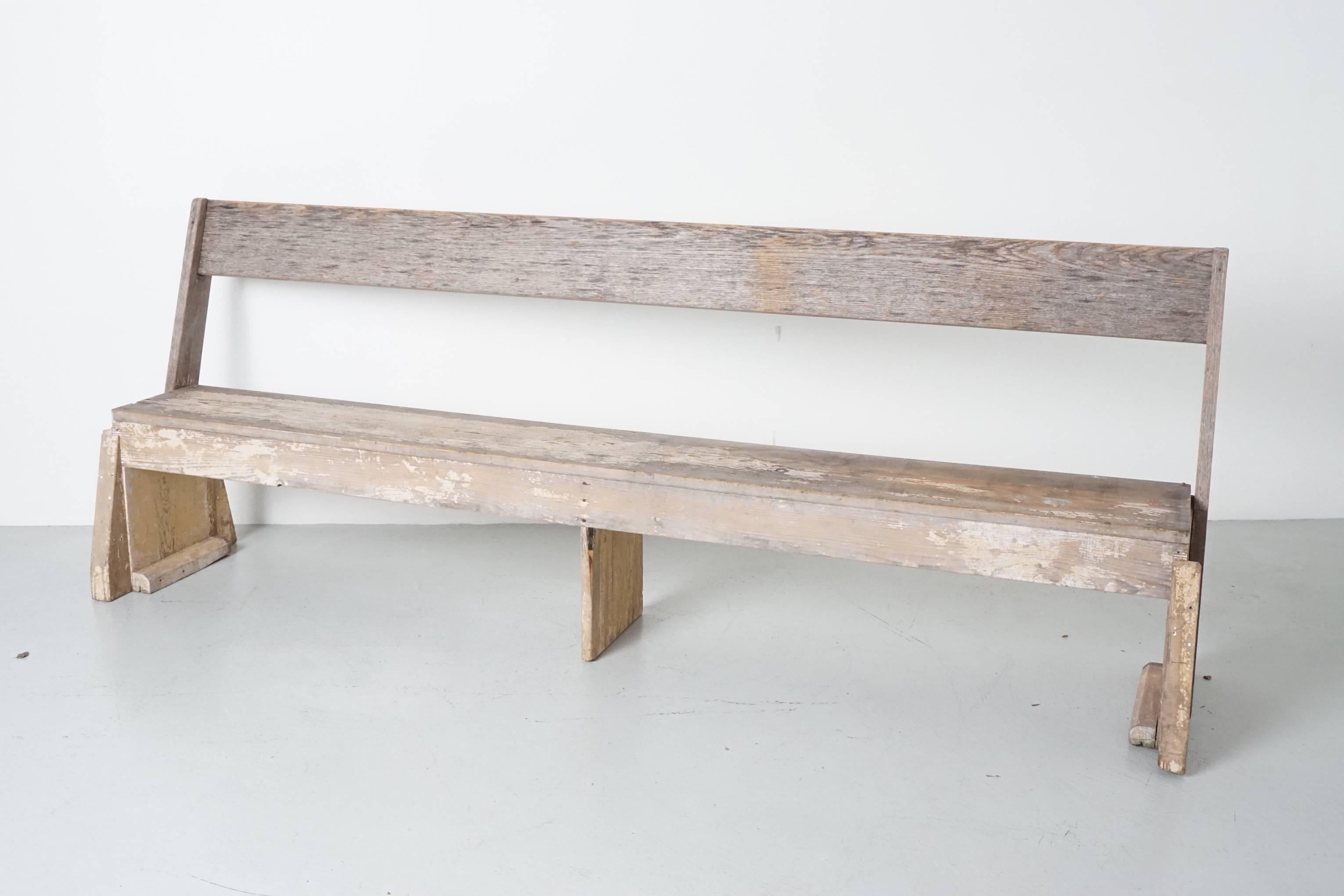 Antique bench salvaged from an old New England fire house station.
Back of bench flips to switch sides (like a railroad bench), most likely the bench was located in the middle of the station where firemen could rotate it according to which engine