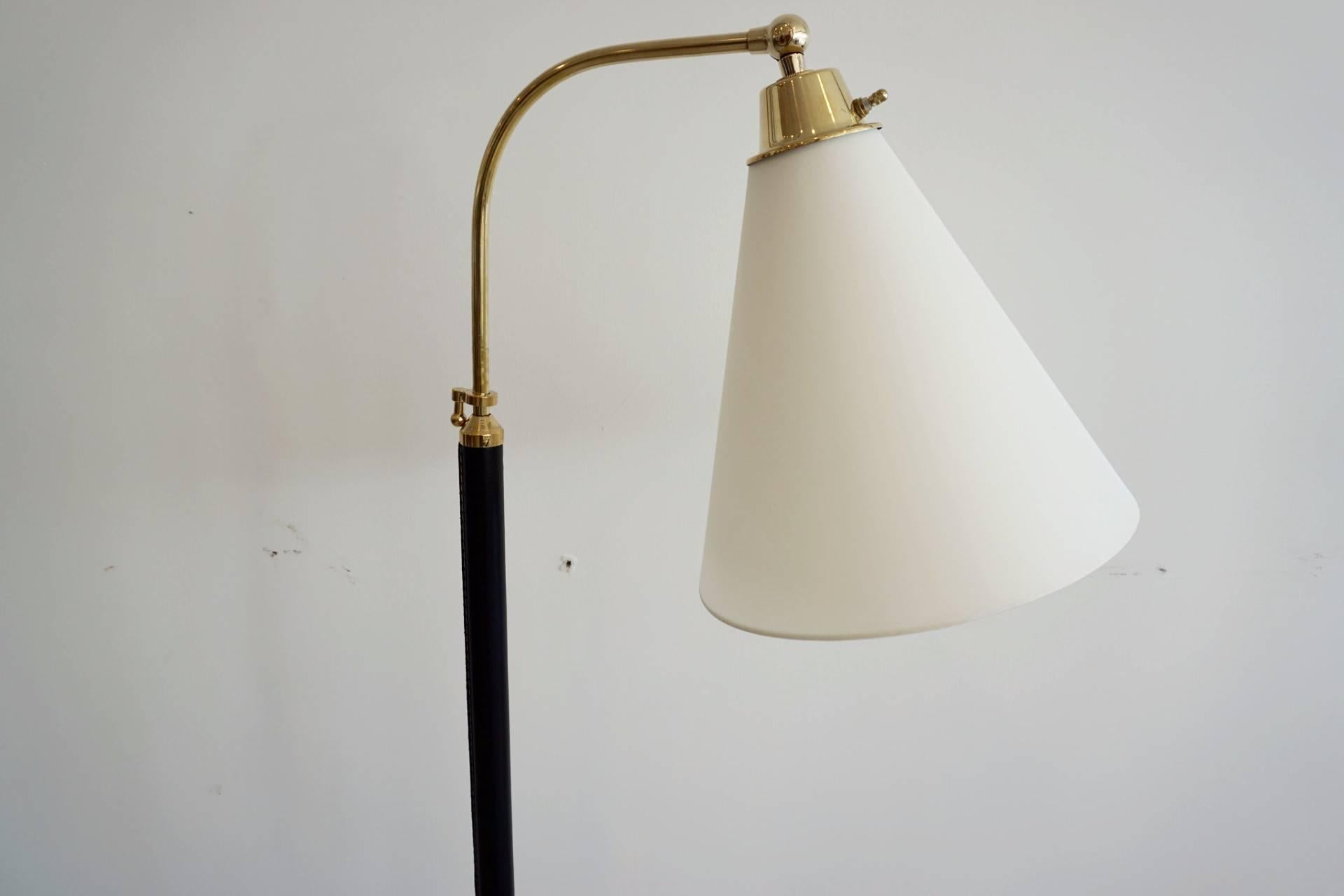 Fantastic French floor lamp with hand-stitched black leather, brass tripod base and new cone shaped silk shade. 
Newly rewired. 

Height extends from 49