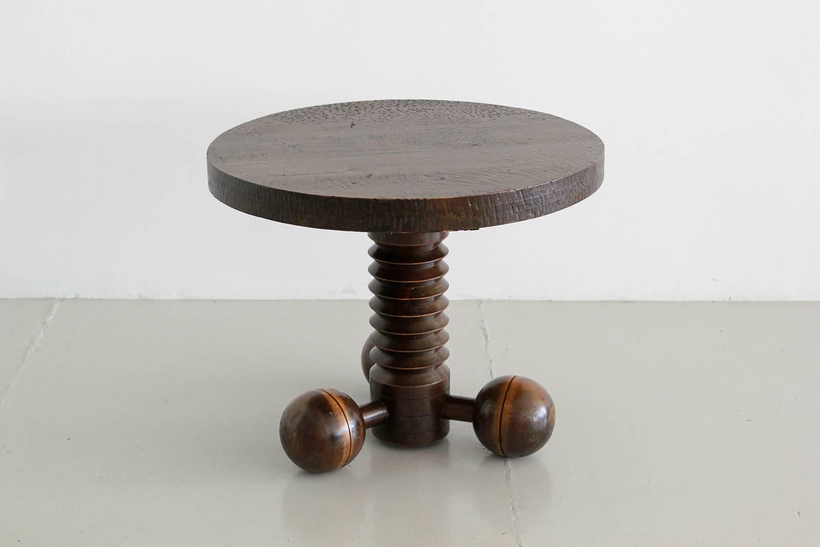 Side table by Charles Dudouyt with three wood balled feet and carved corkscrew base, and carved top.