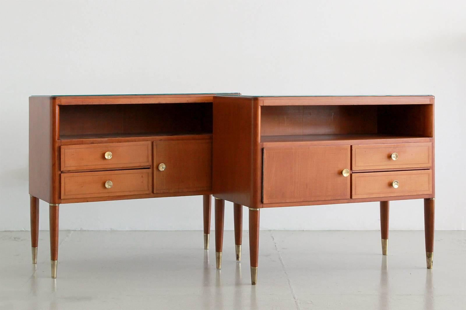 Pair of Italian nightstands by Paolo Buffa. Beautiful mahogany wood with open storage and drawers. Original glass with brass hardware and tapered brass feet.