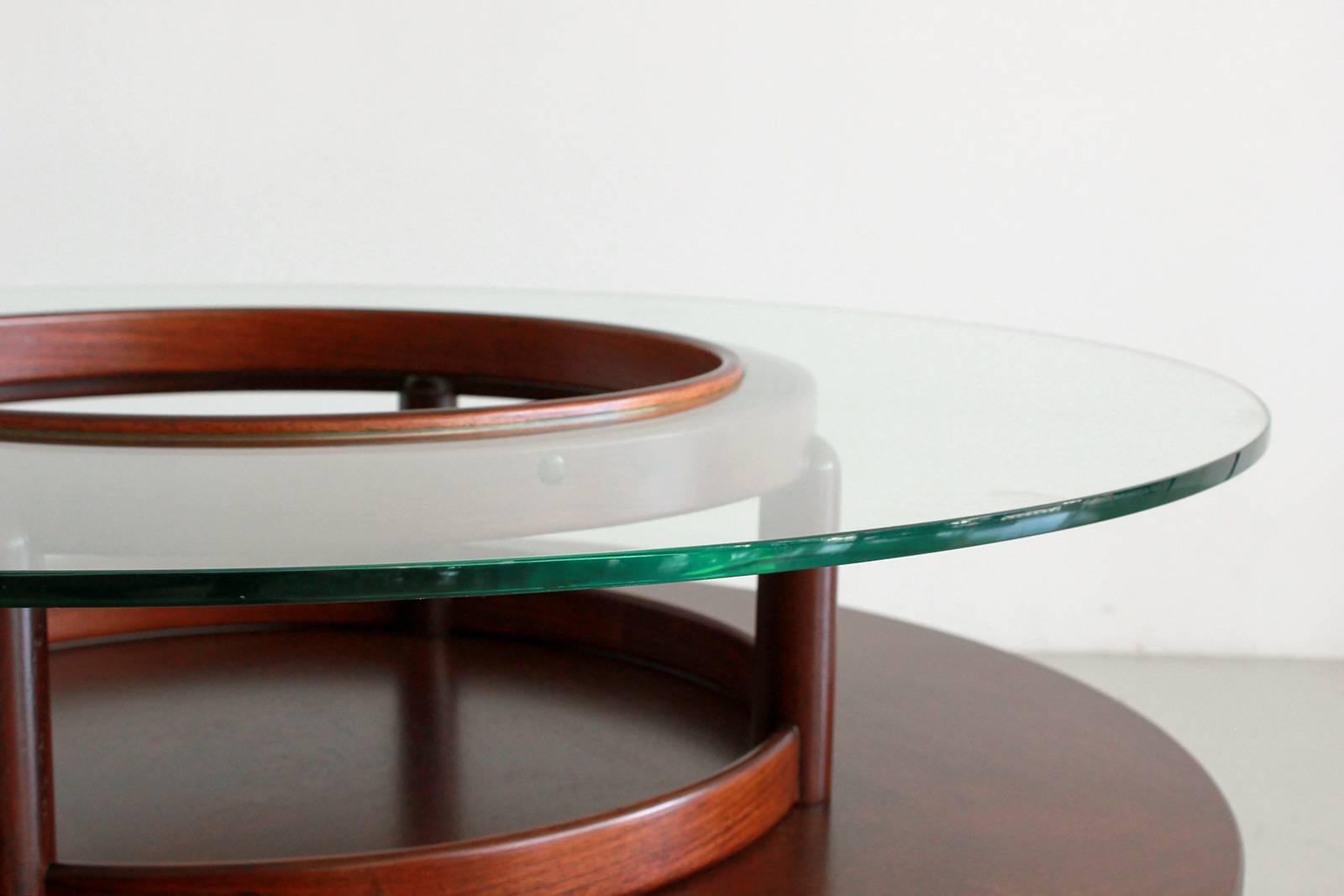 Exquisite Italian mahogany and floating glass table.