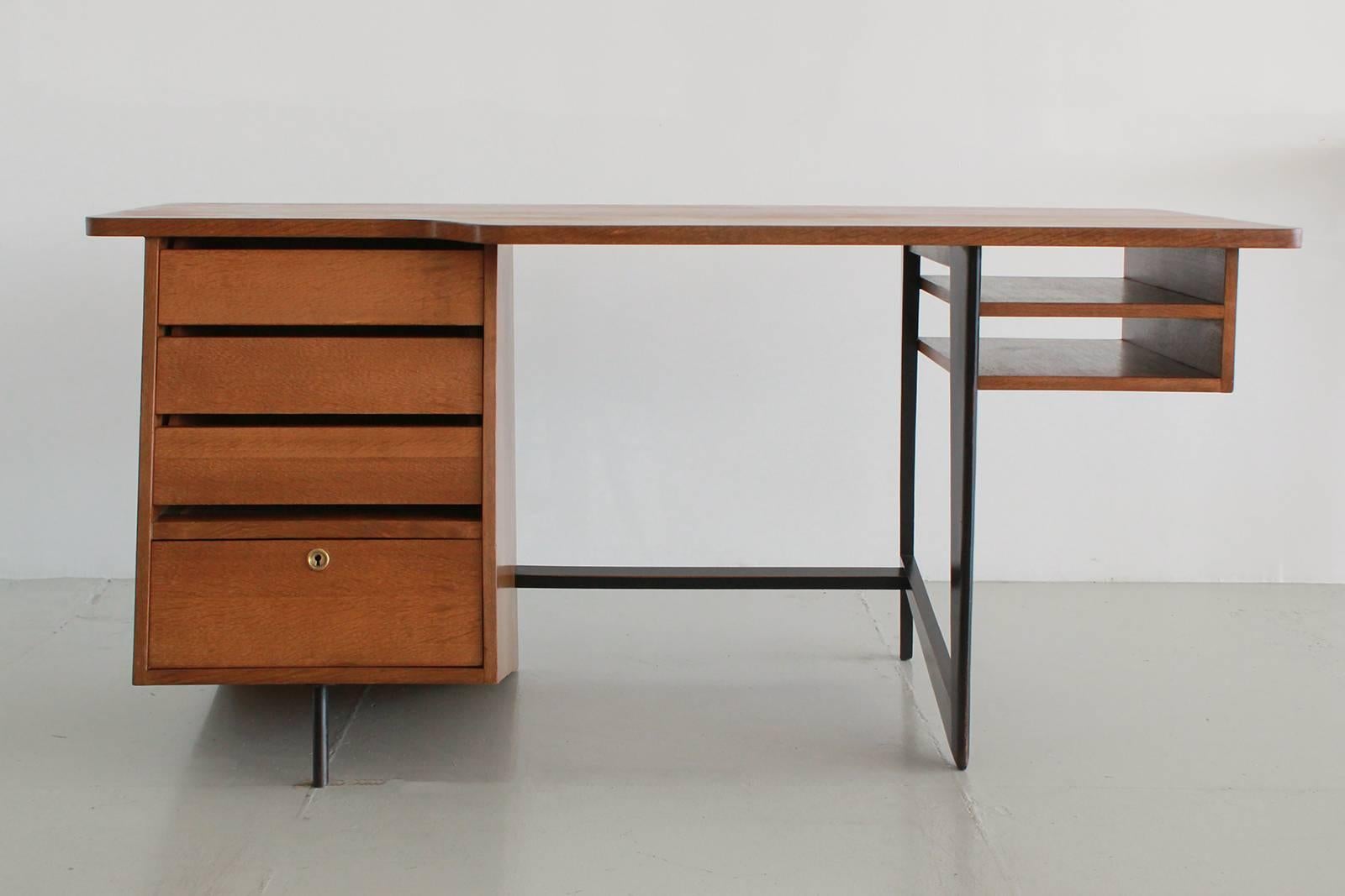 Stunning desk designed by Claude Vassal with fantastic angles and original oak finish.