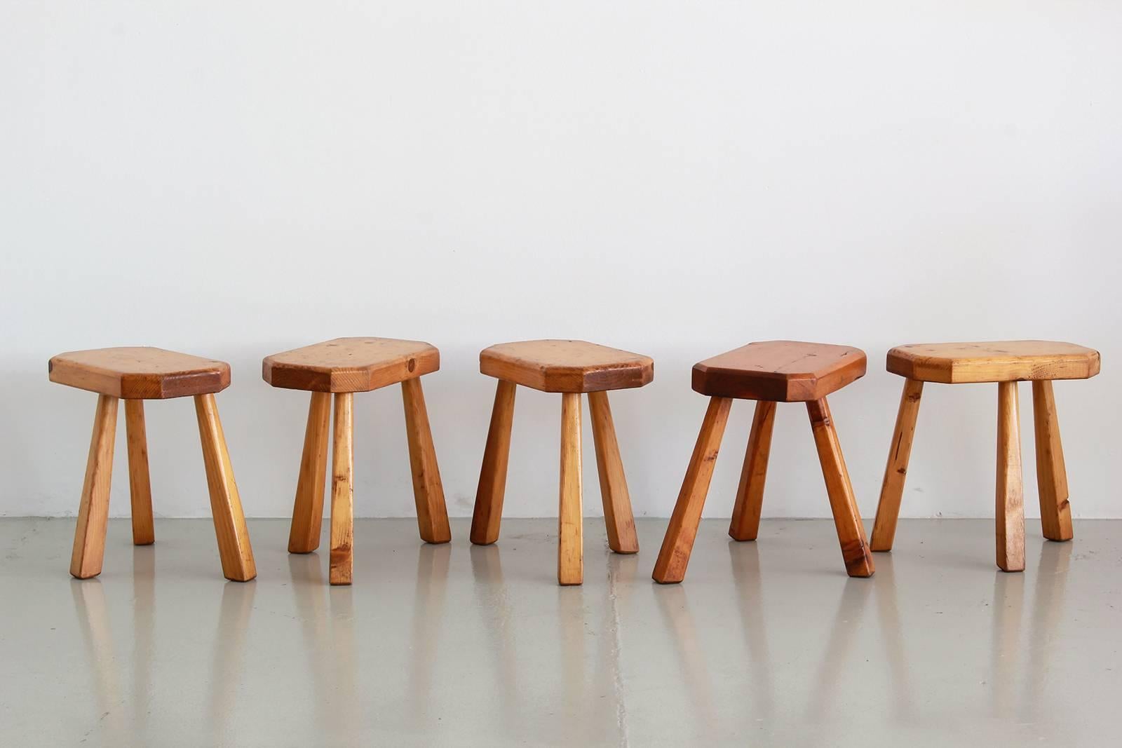 Petite oak stools in the style of Charlotte Perriand with three legs and octagon shaped seats. Three available. Sold individually.