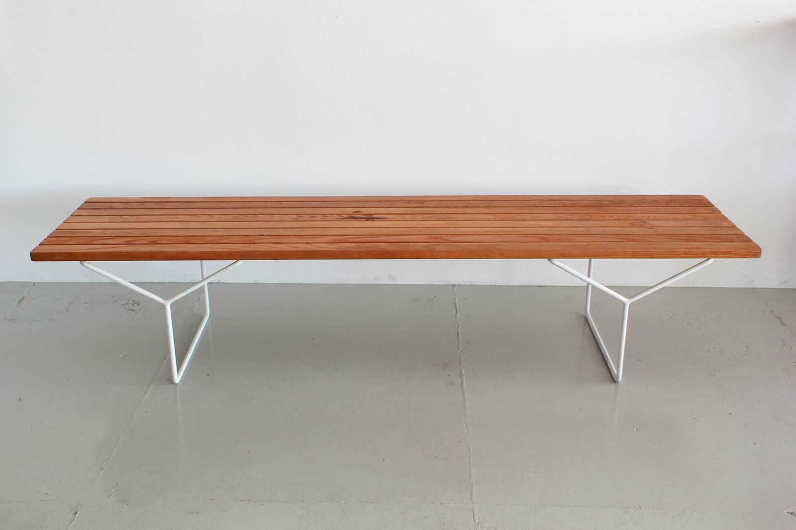 Slatted wood bench by Harry Bertoia for Knoll International.
Rare white metal legs. 
Great patina to ashwood.
