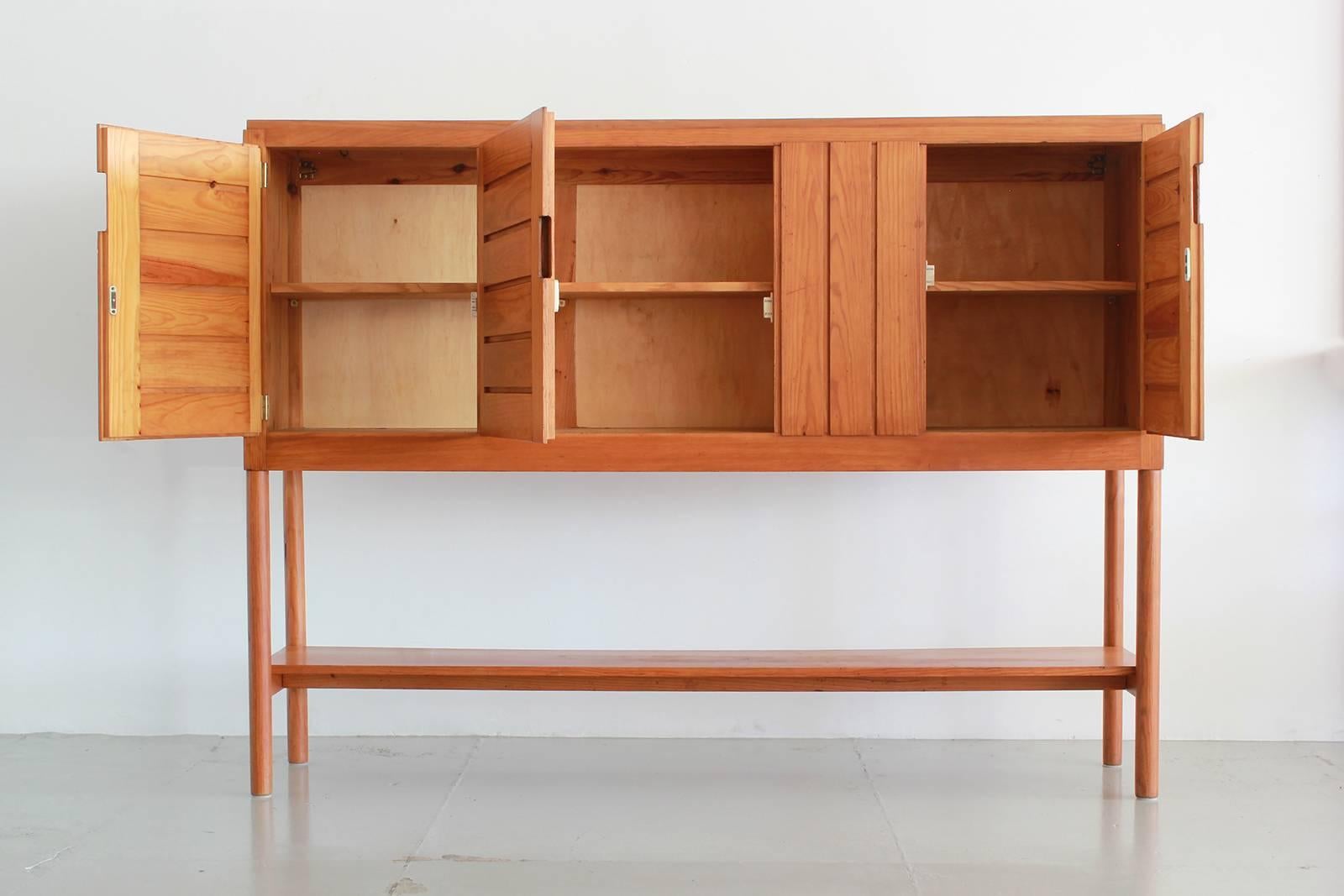 Wonderful French buffet designed by Pierre Gautier-Delaye.
Constructed in 1957, pine with original patina - opens with three doors with interior shelving.
Fantastic piece!
             