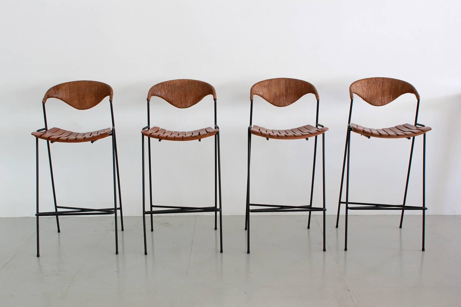 Amazing barstools by Arthur Umanoff for Raymor. Iron bases with rushed back and wood slatted seats.
Excellent vintage condition.
Priced individually. $5600 for set.