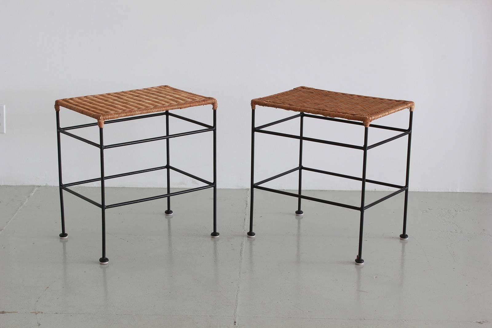 Pair of wicker top night stands or end tables designed by Arthur Umanoff with iron frame.