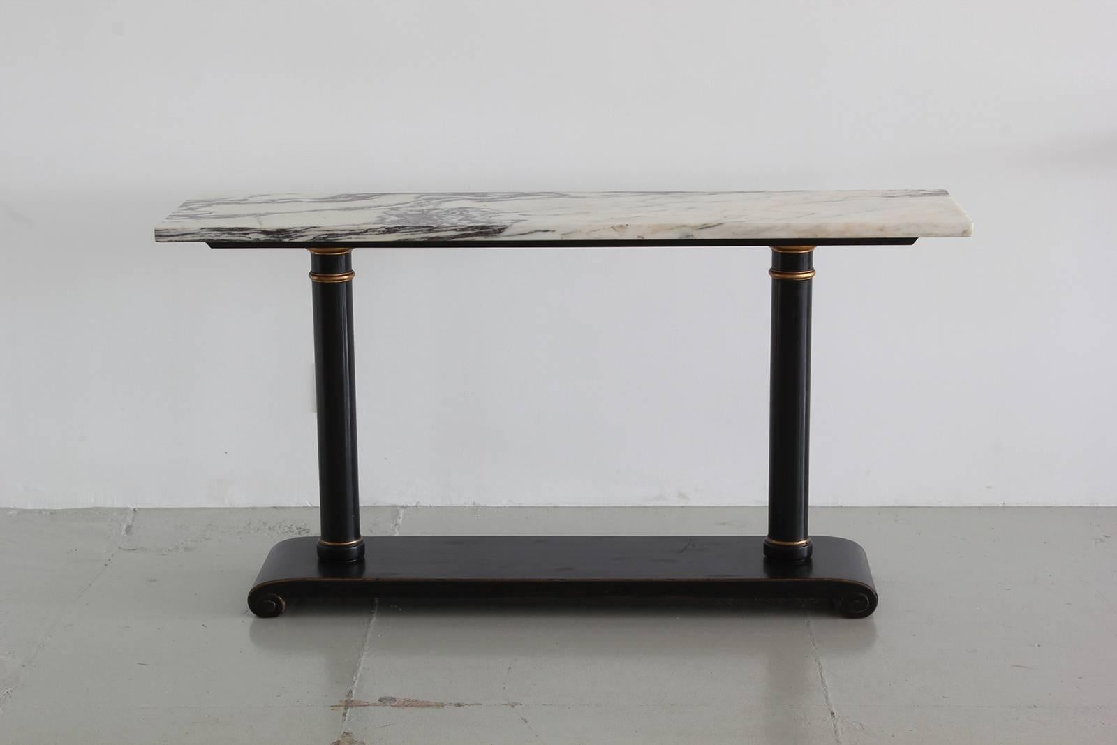 Wonderful Italian marble console with black pedestal column base.
Grain on the marble is fantastic!
Simple modern lines.