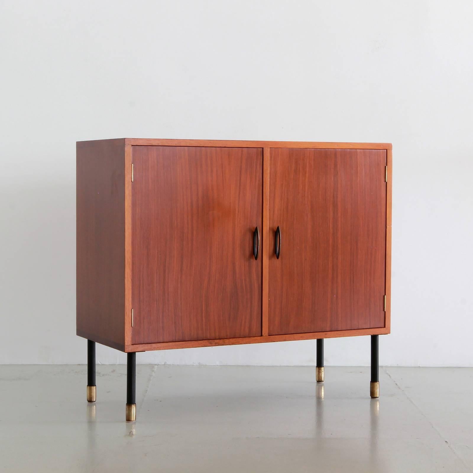 Handsome Italian cabinet by I.S.A Bergamo with open cabinet shelving on both sides. 
Brass hardware on iron legs and brass feet.
Total of three similar cabinets available.