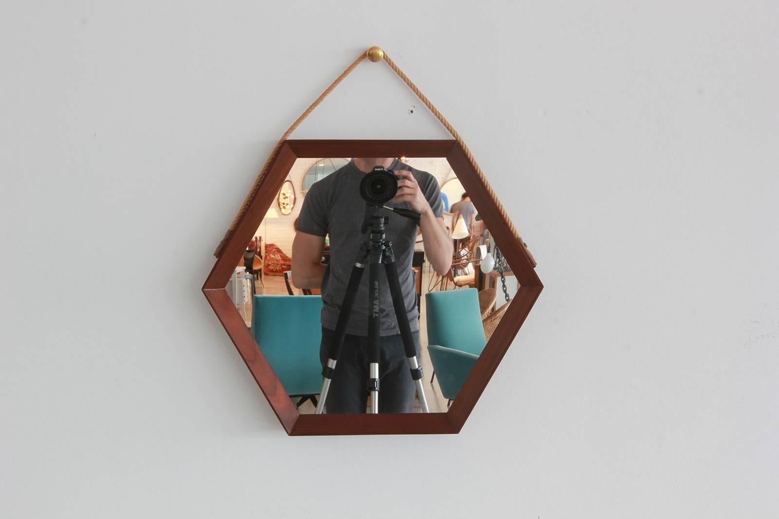 
Vintage Hexagonal mirror with rope strap and red leather tassle attachment

Bottom of mirror to top of rope measures 23