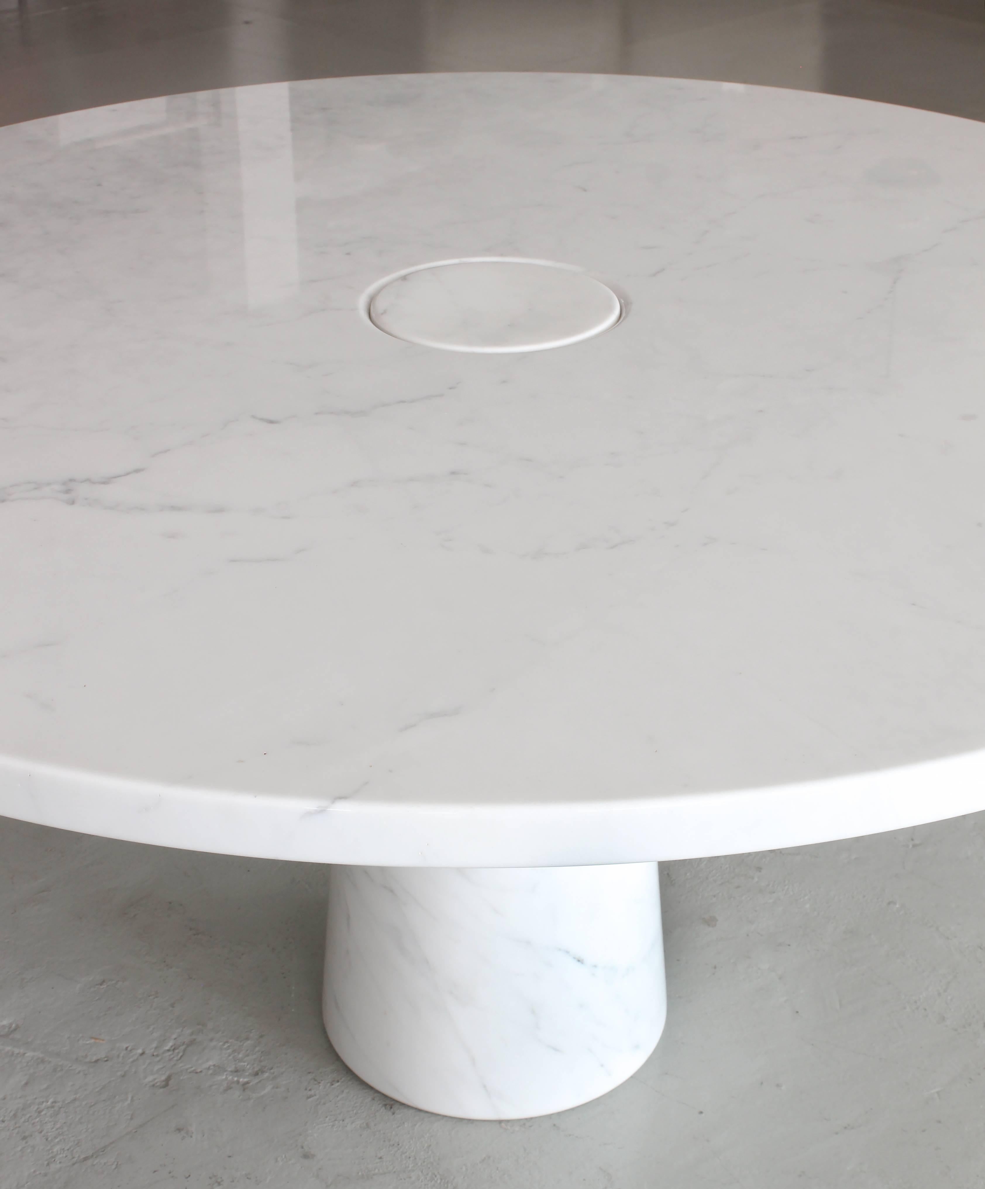 Absolutely magnificent large round marble dining table from Mangiarotti’s Eros series. Beautiful Carrara marble top floating over marble conic pedestal with light white veining throughout. Could also work as an entry table in a grand foyer.