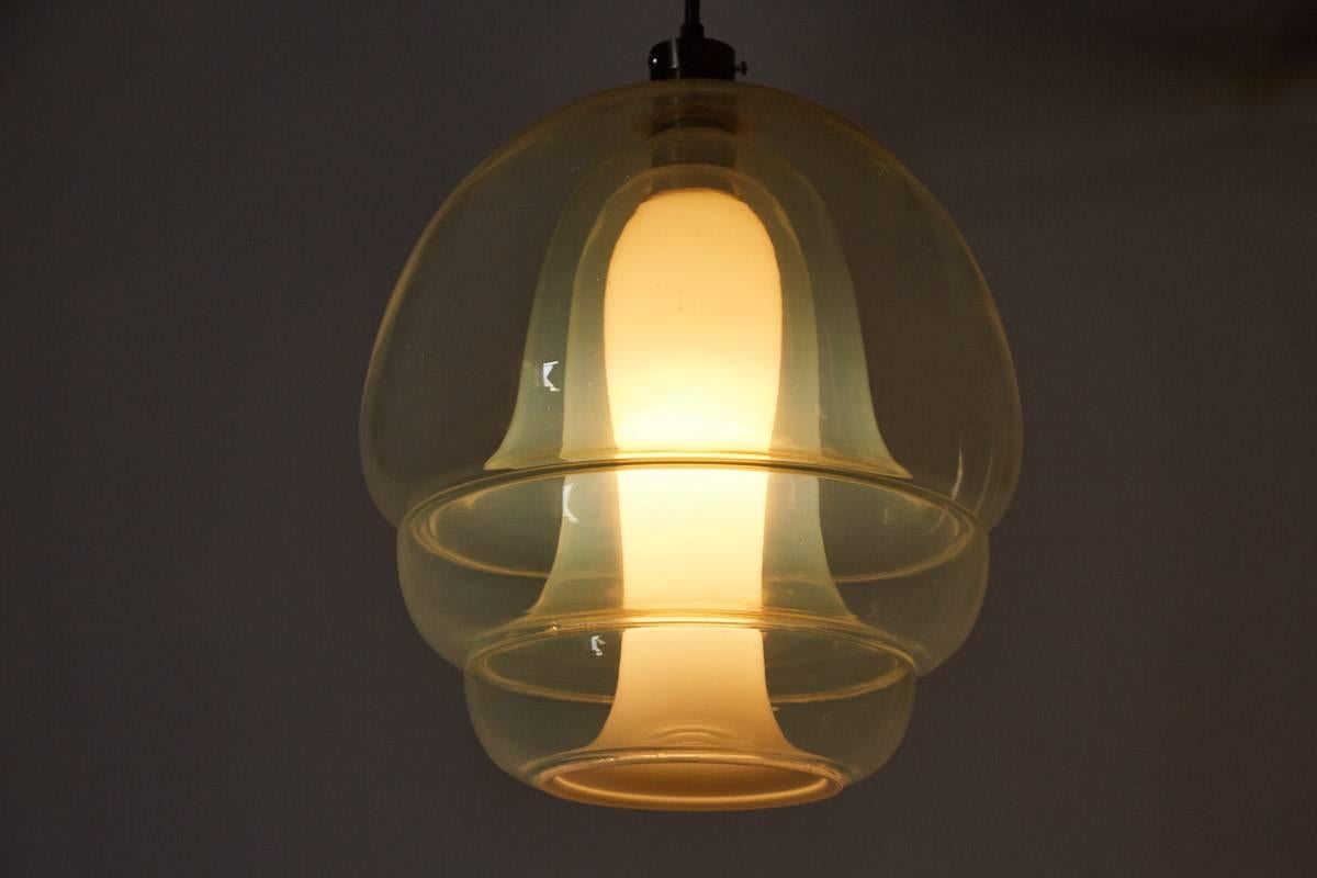 Gorgeous Mazzega pendant designed by Carlo Nason for Mazzega. Extremely rare and composed of four interlocking clear glass and handblown in to a single mold. Absolutely exquisite when illuminated. Looks like a jellyfish!