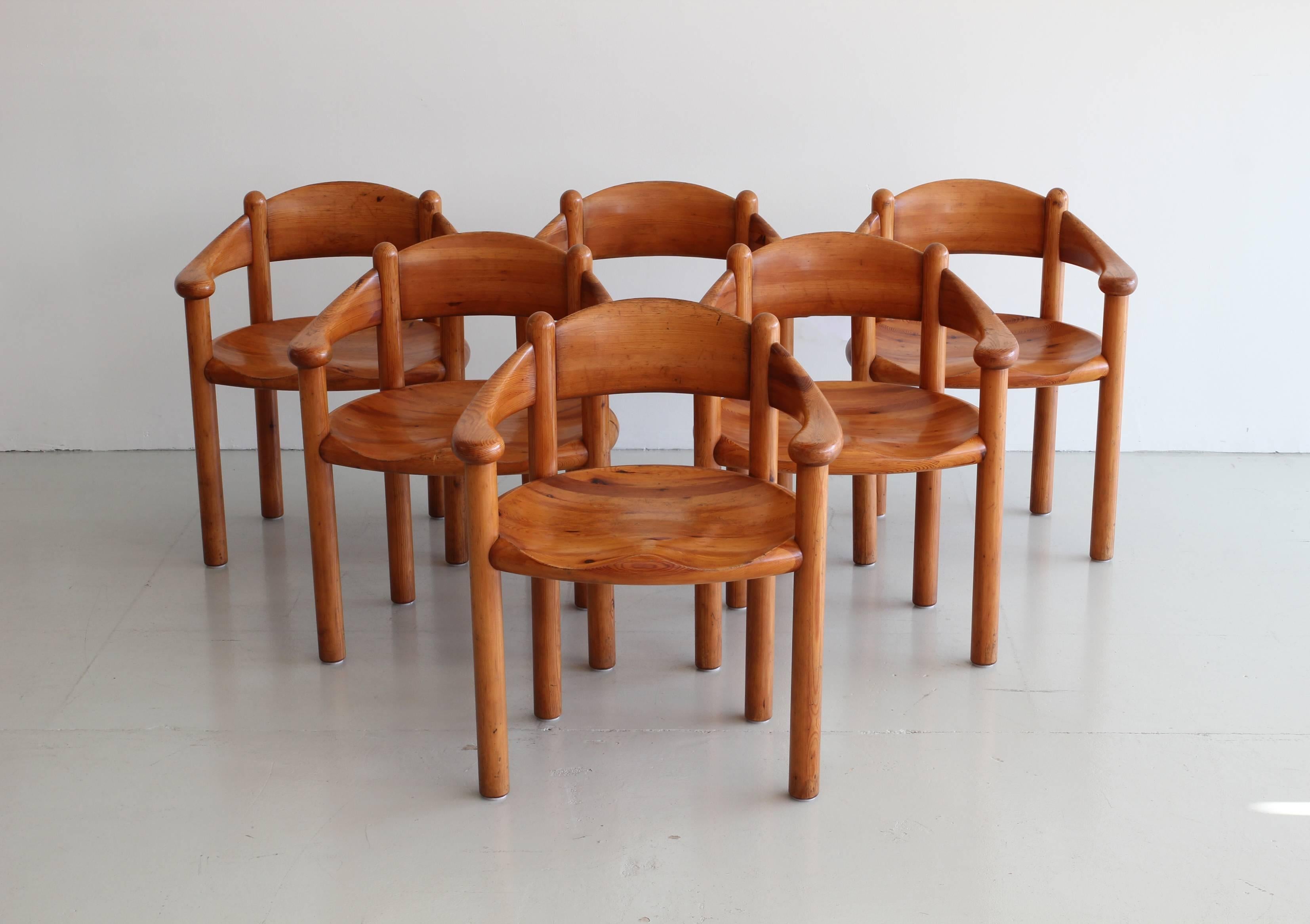 Rare Set of six sculptural armchairs by Swedish architect Rainer Daumiller. Fantastic sculptural shape and wonderful patina to the wood formed seats. Arm height: 24.5