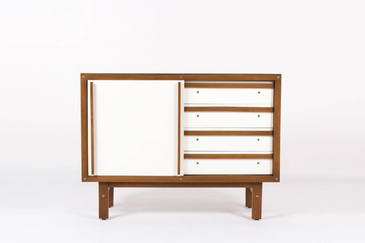 Rare dresser cabinet by French cabinetmaker Andre Sornay. Cabinet is white and oak with sliding doors revealing drawers on one side and open shelving on the other.