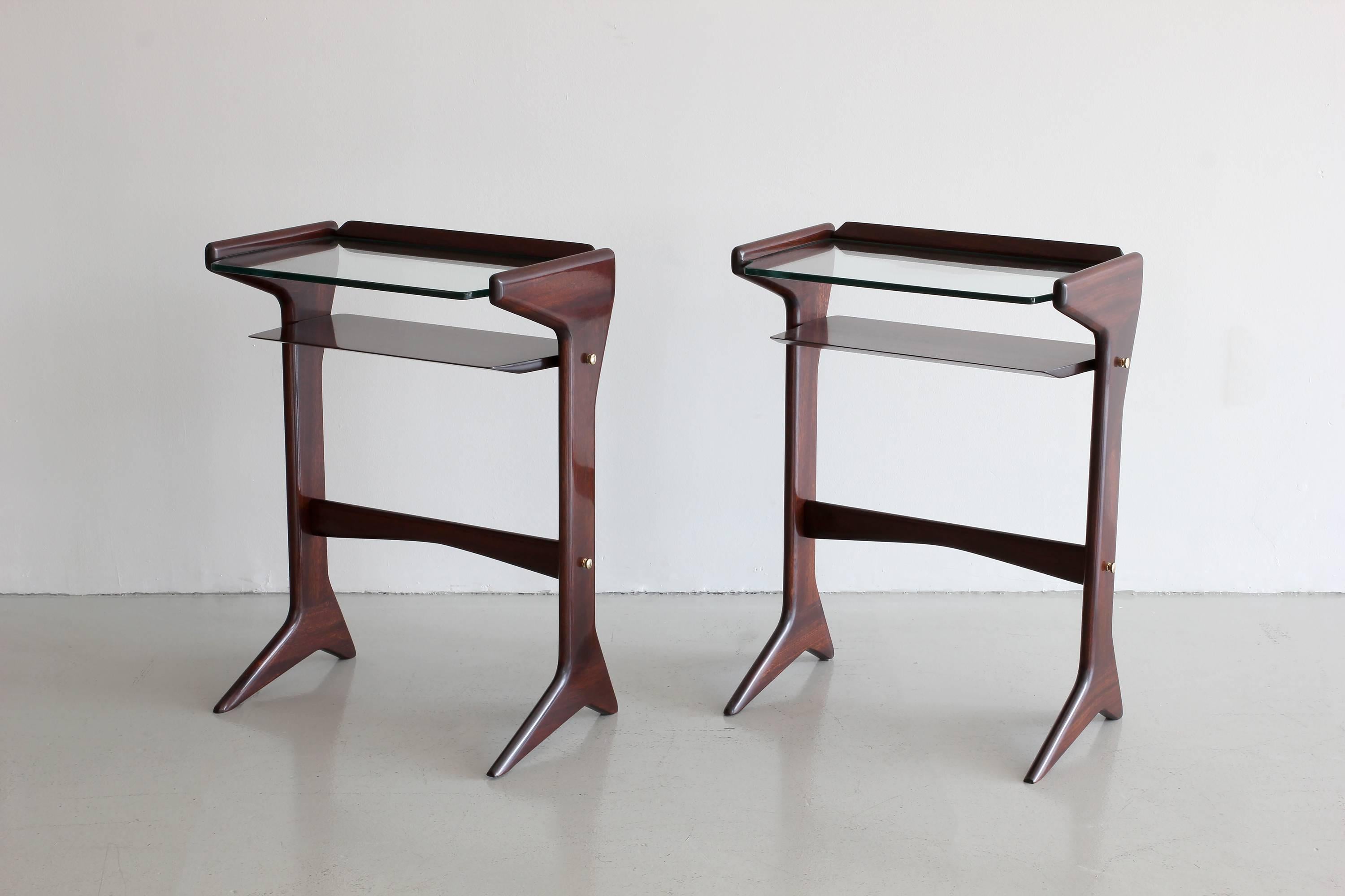 Beautiful Italian glass end tables by Ico parisi. 
Mahogany with cantilevered glass tiered surfaces. 
Wonderful lines and scale. 
Professionally refinished in French polished mahogany.
Brass joint hardware.