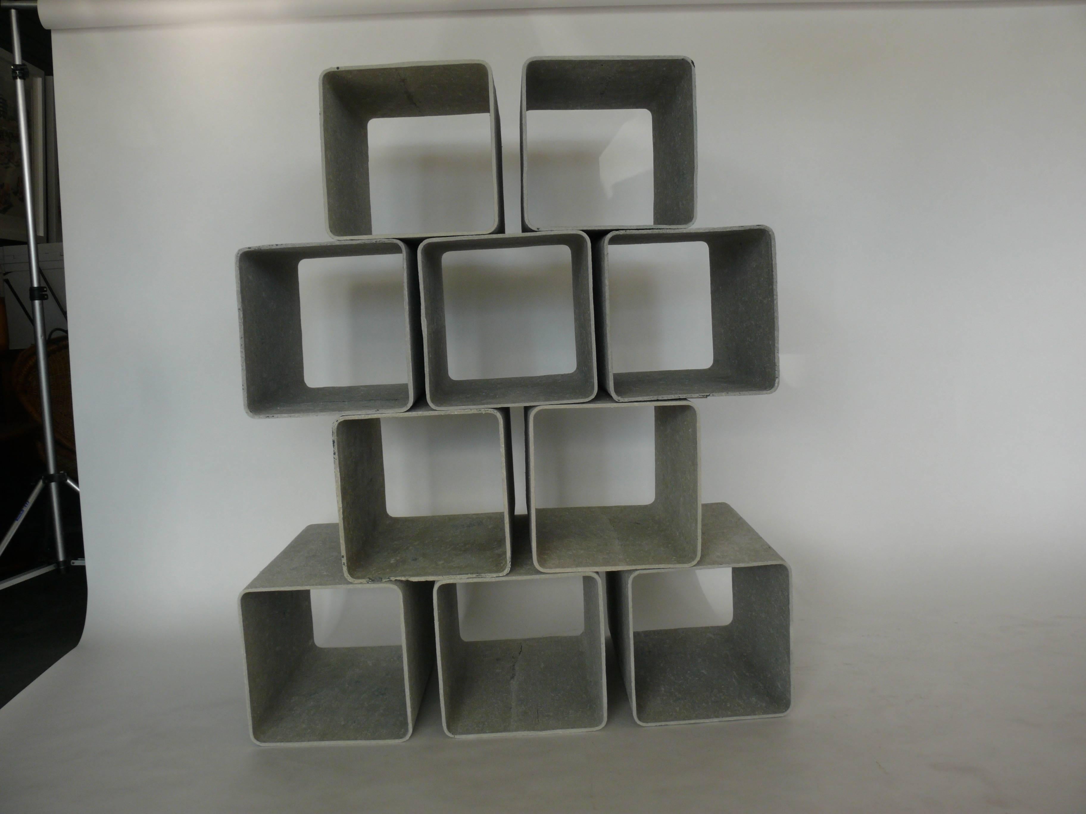 Incredibly rare cement and fiber modular shelving cubes by Willy Guhl.  Each cement cube is free standing and light weight enough to rearrange with ease. 
Great patina!  Would make an incredible room divider, media storage, or display shelves! The