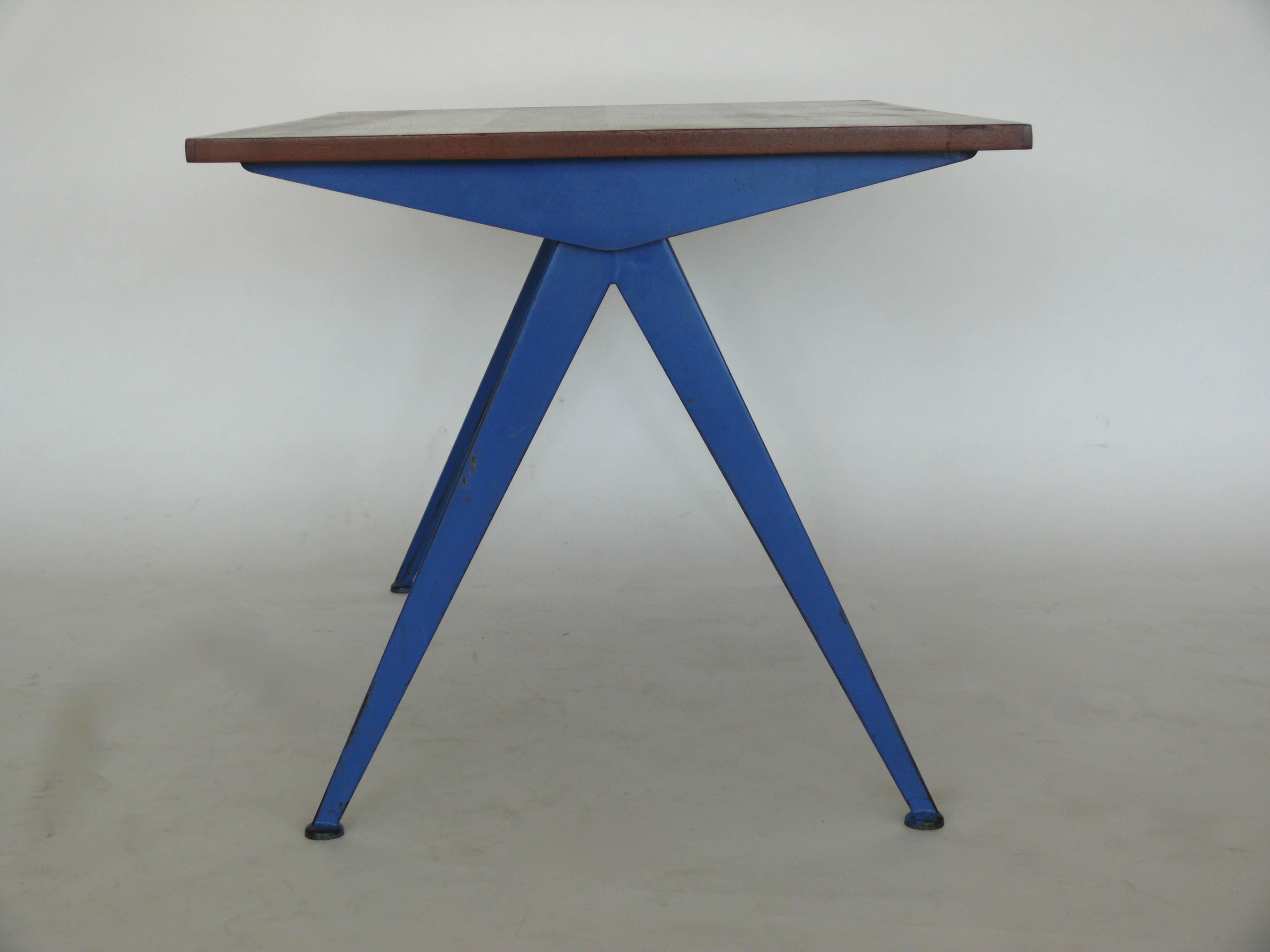Stunning example of the iconic Compas desk, manufactured by Ateliers Jean Prouve, circa 1953. Oak top with rare blue enameled steel legs.