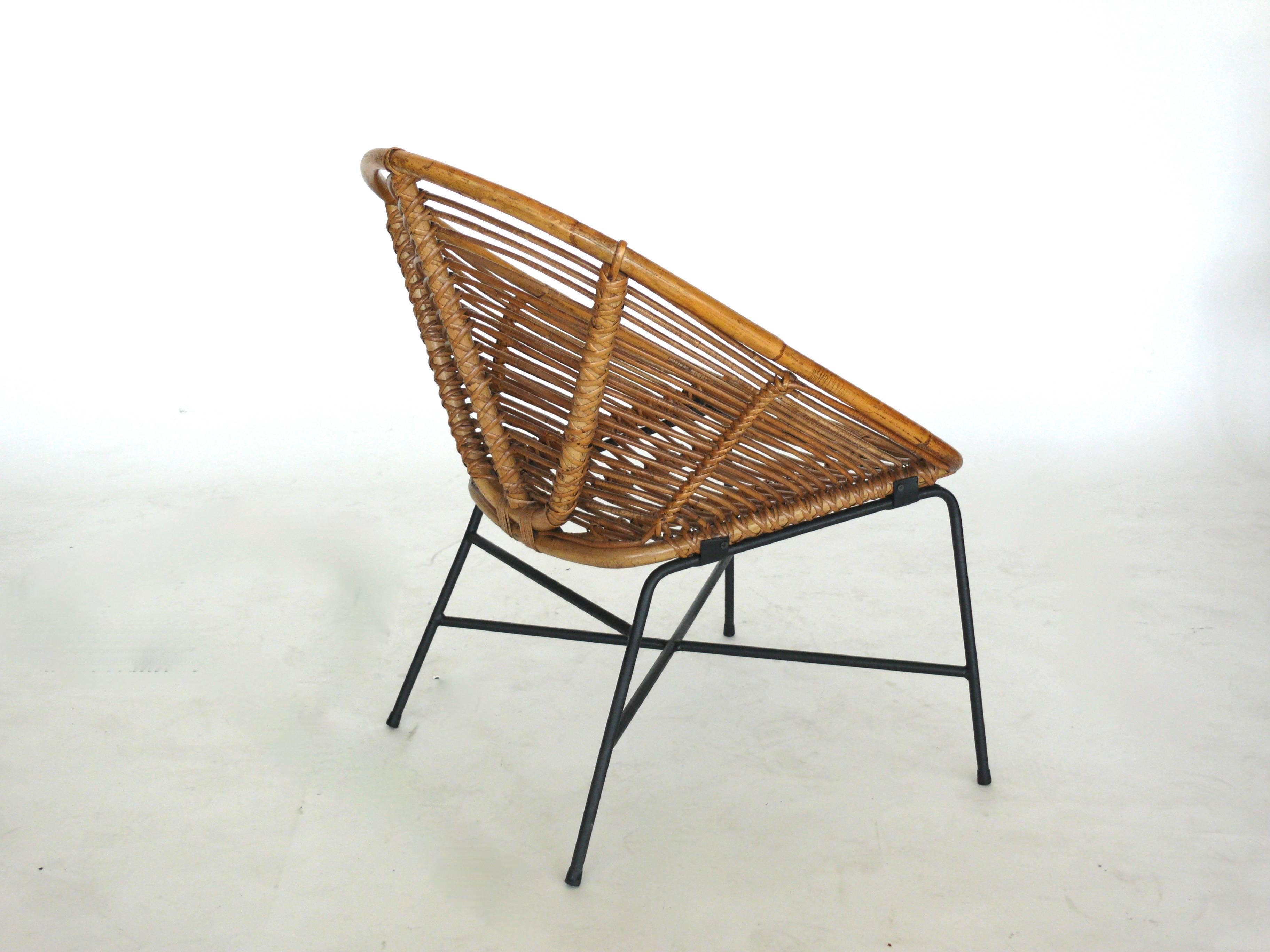 Pair of French rattan and iron chairs in the style of Franco Albini. 
Two pairs available!