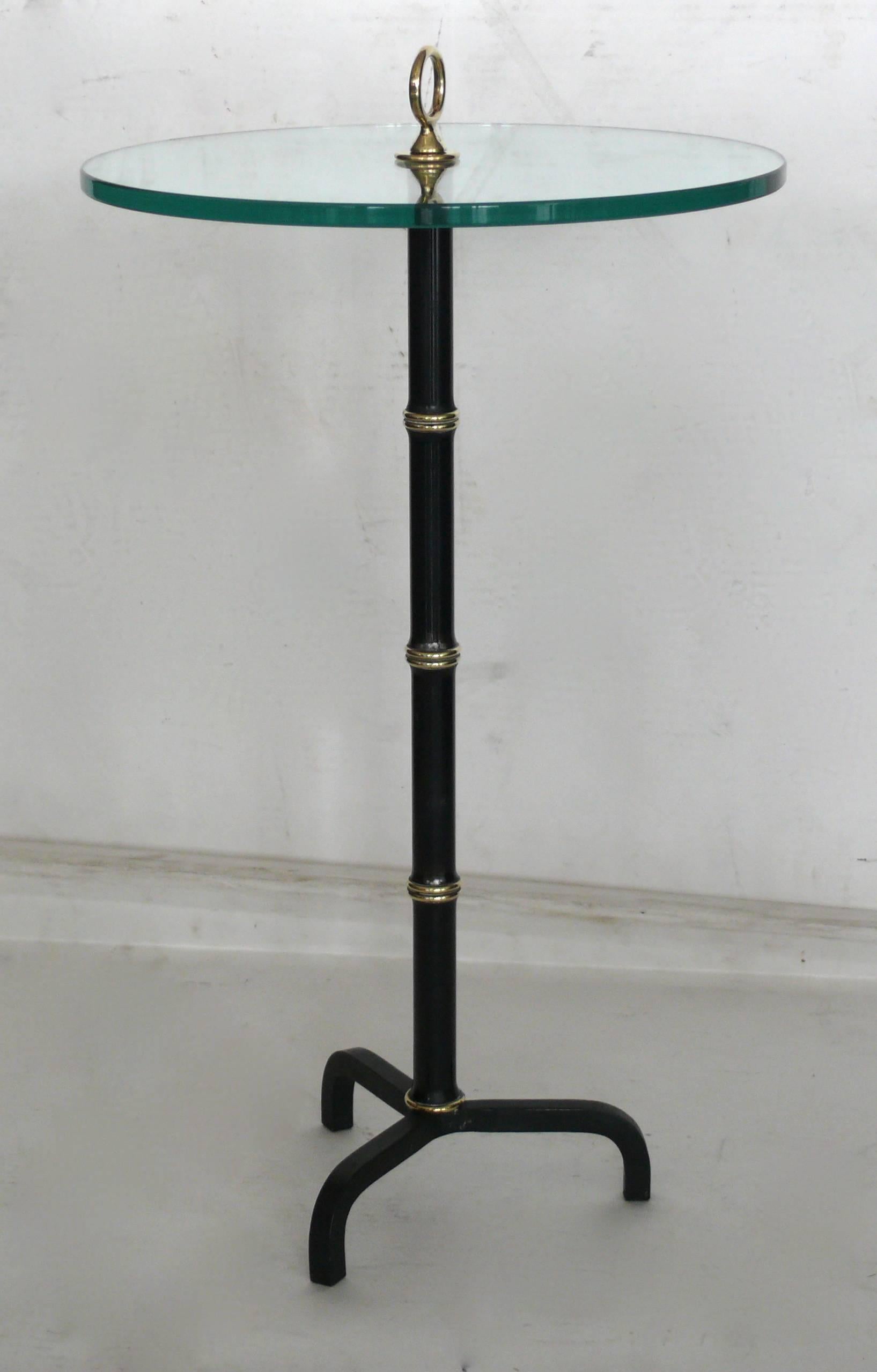 Art Deco in the style of Adnet tripod table with bamboo iron and brass bamboo stem with brass finial.  Excellent vintage condition. Perfect cocktail table.