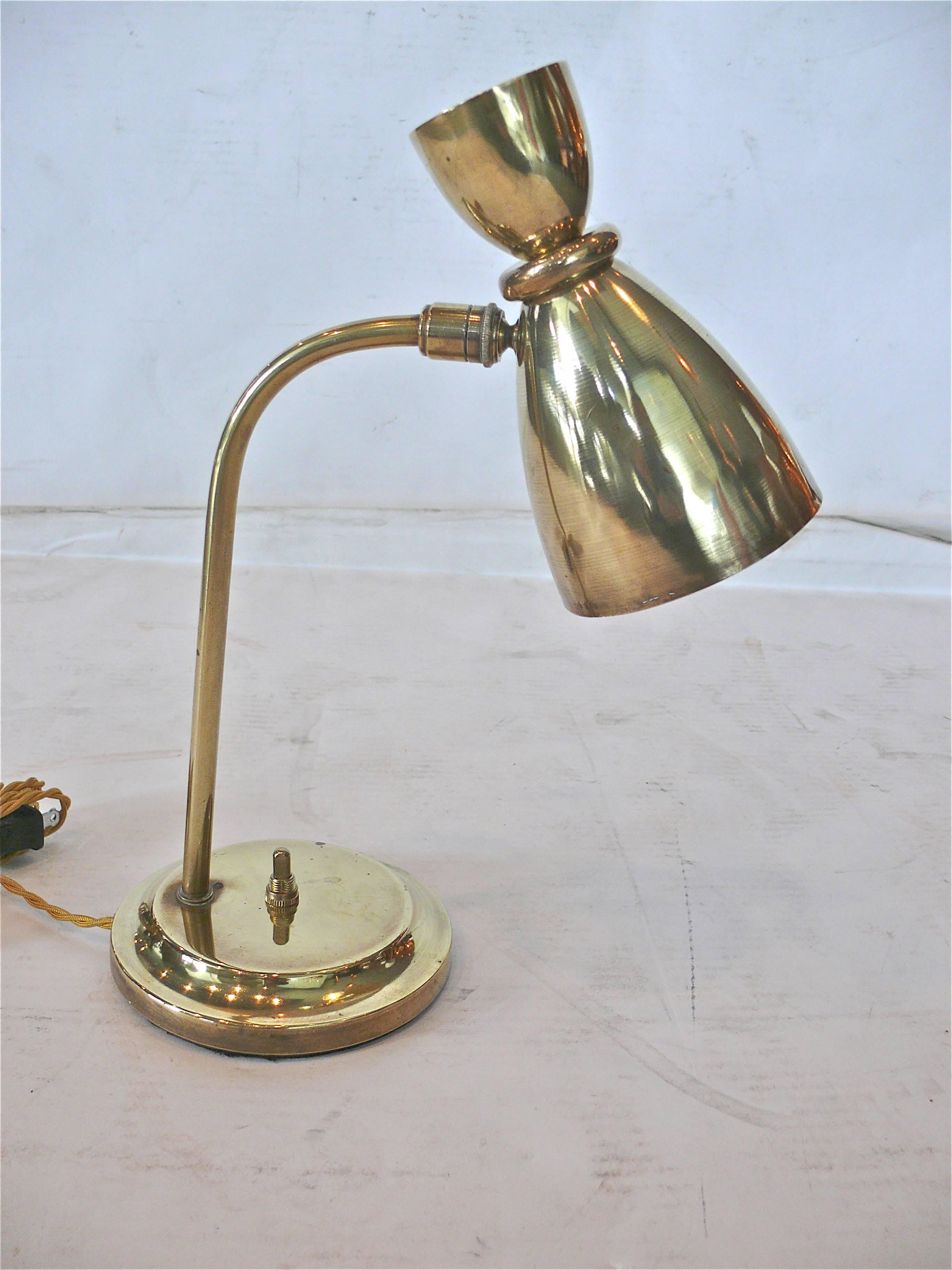 Petite French brass desk lamp in the style of Pierre Guariche. 
Great function and patina. Newly re-wired.