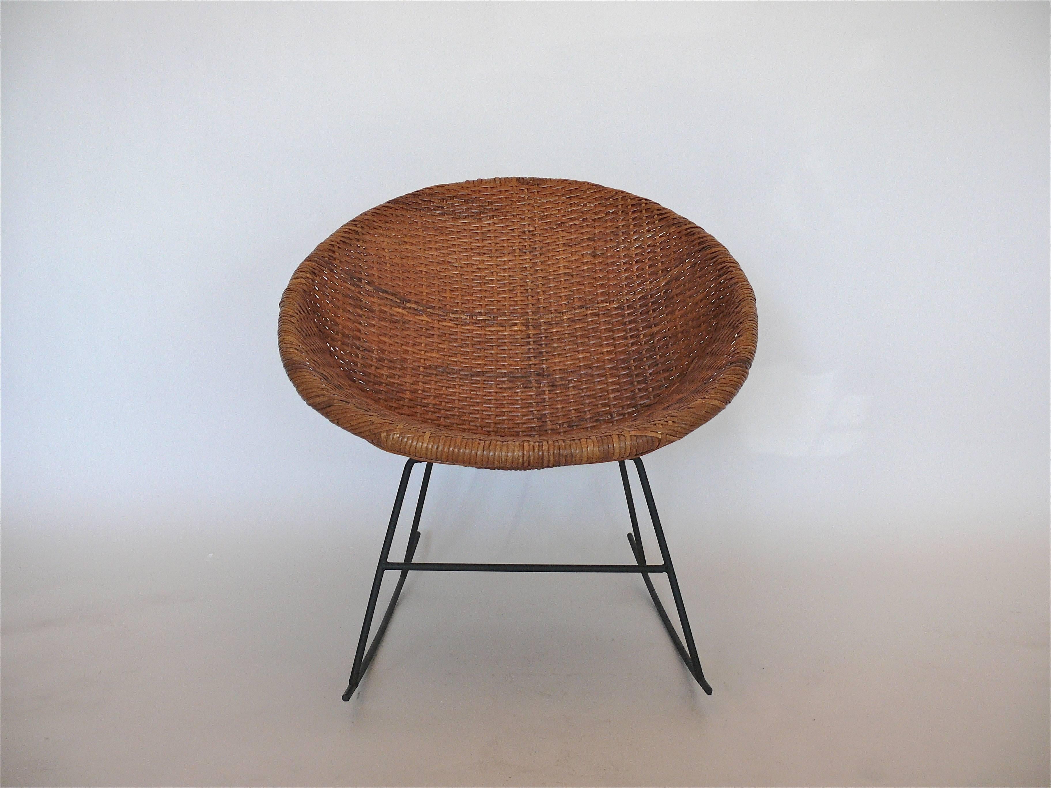 Rare Calif Asia iron and wicker rocker. Manufactured in the Philippines for Calif Asia in the 1960s. A stunning wicker bucket chair sits upon an iron rocker base. Perfect for corner in any room!
Excellent original condition.
A matching rocker