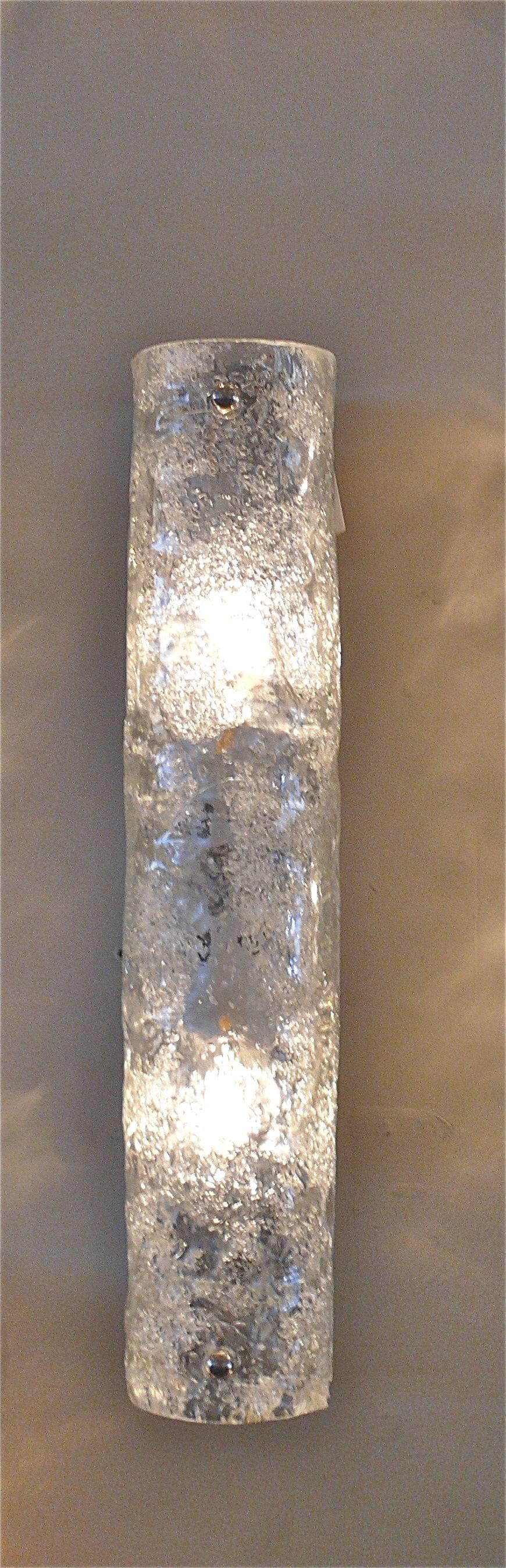 Pair of Austrian tube sconces made of thick clear textured ice glass in a curved tube shape with chrome hardware. 
Simple and clean design.
Can be hung horizontally or vertically. 
Newly rewired.
Sold as a pair.