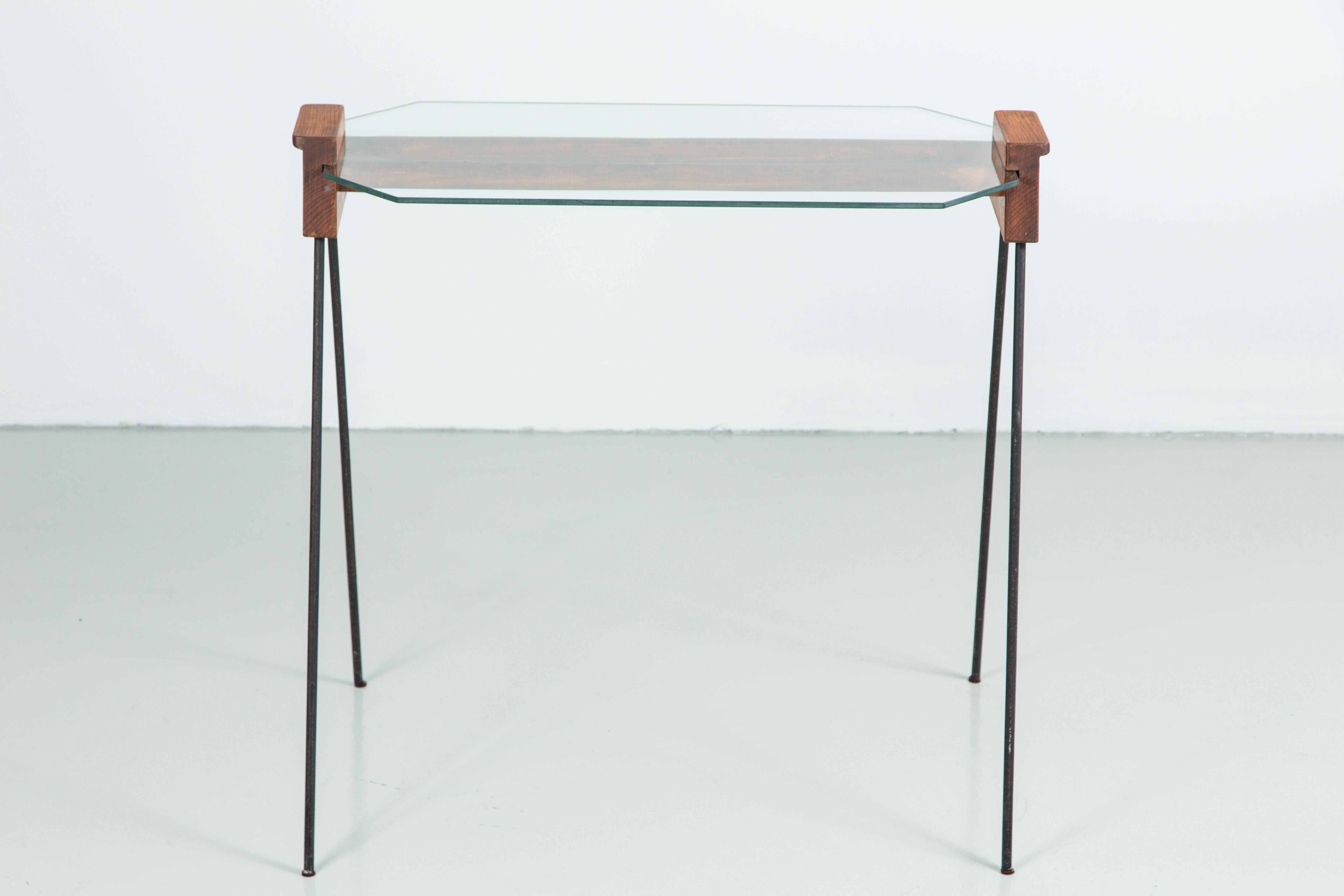 Great stylish table in the style of Arthur Umanoff with simple black iron legs, wood slatted detail and glass top.