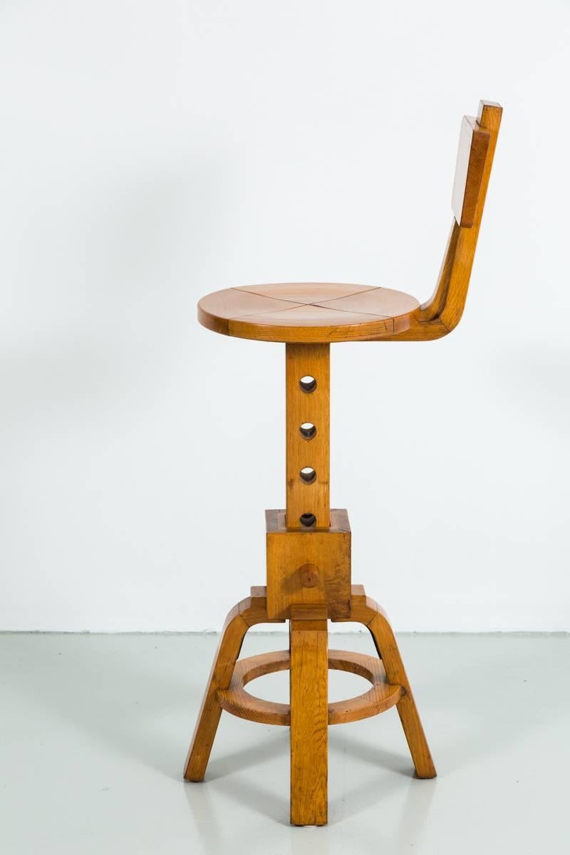 Great set of unique French barstools designed with peg to heighten or lower the seat to counter or bar height. Fabulous patina to wood. Price per stool.