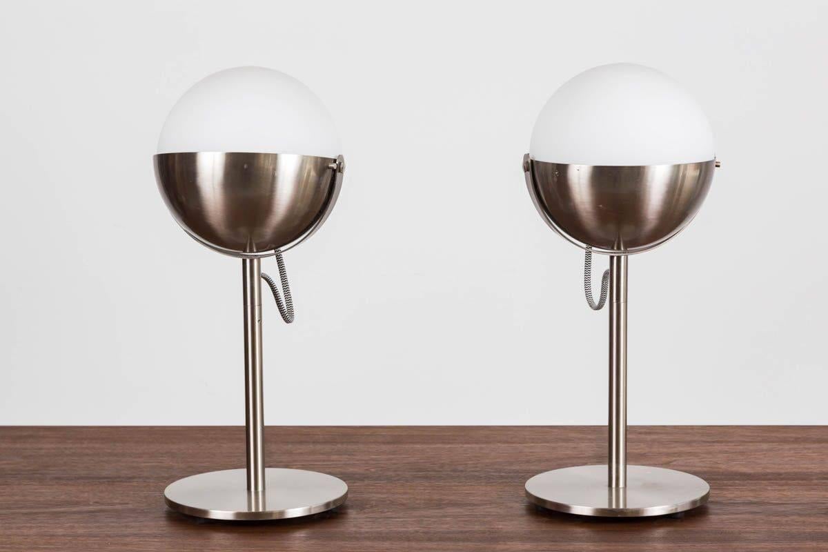 Pair of original Andre Putman designed table lamps custom-made for Morgans Hotel in New York City owned by Ian Schrager.
Globe sits on pivoting shade.
Sophisticated elegance.
Manufactured with original stamp by Fontana Arte.