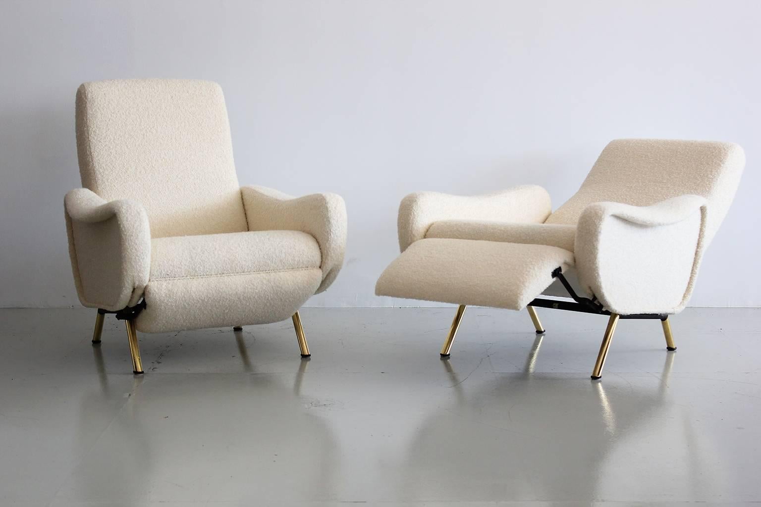 Pair of Italian armchairs by Marco Zanuso reupholstered in creamy wool bouclé and polished brass legs. Each chair fully reclines to approximately 60