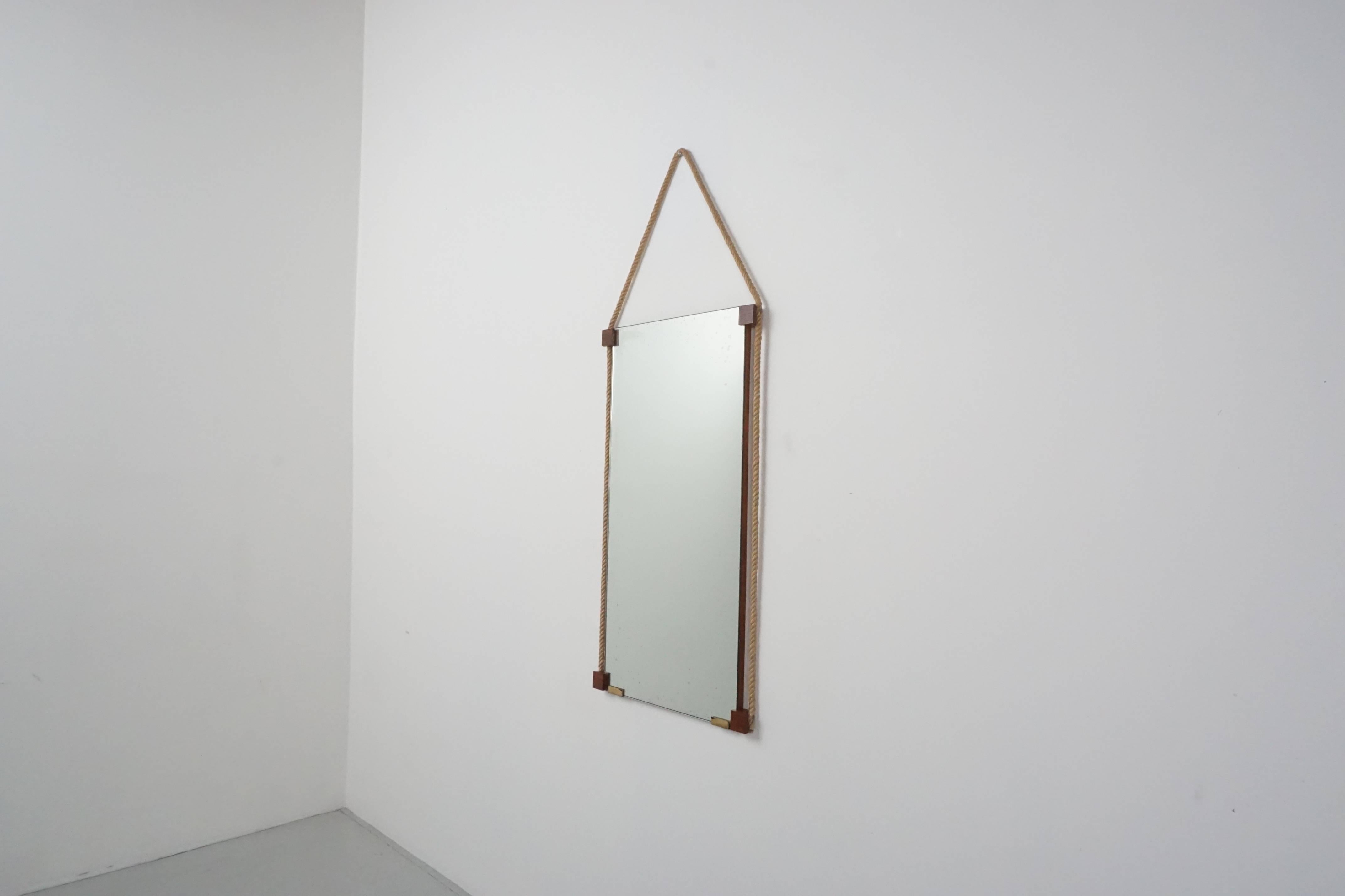 Fantastic rectangular shaped Italian mirror framed with floating rope and mahogany square corners. Great simple design.