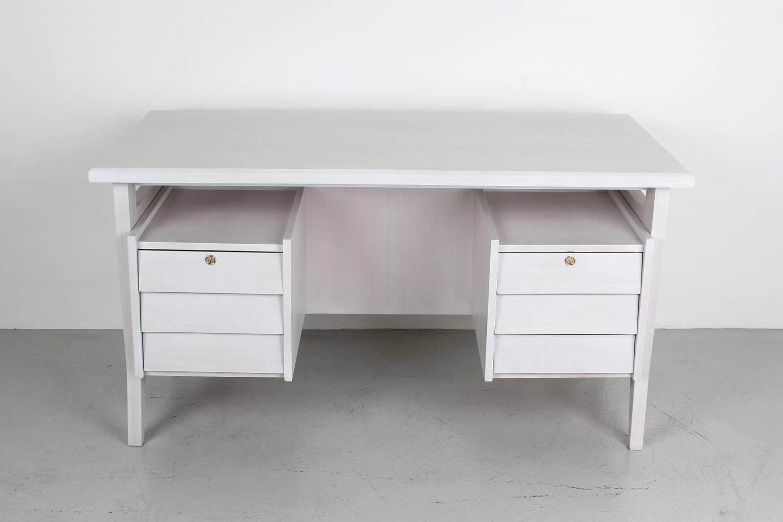 Gorgeous desk by Gio Ponti. Original brass hardware. Impressive in size and scale with pull-out drawers flanking each side of the desk. A fantastic example of Gio Ponti design. A variant of 1940s design for University of Padua, later adapted for the