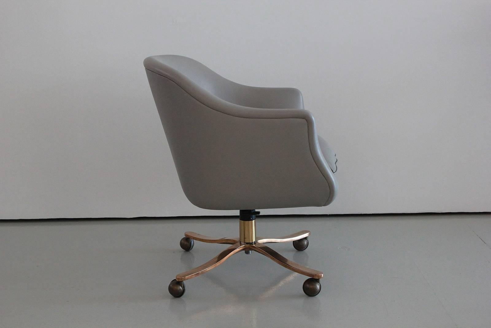 Grey leather desk chair by Ward Bennet for Zographos modern. Bronze swivel barrel conference room chair. Original leather.
Multiple available. Priced individually.