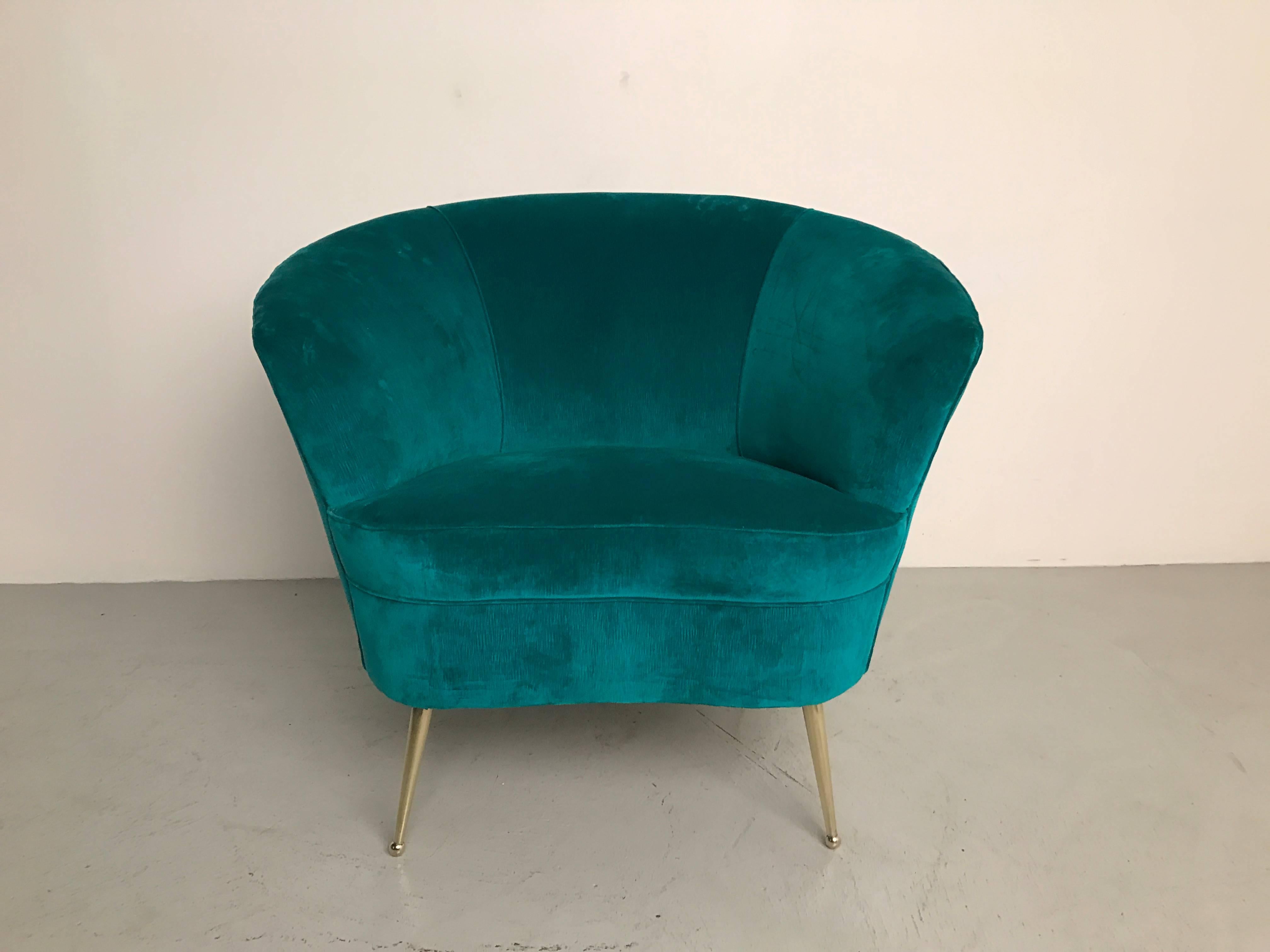 Gorgeous pair of sculptural Italian chairs with amazing line. Newly upholstered in teal velvet with brass legs. Great wide shape!