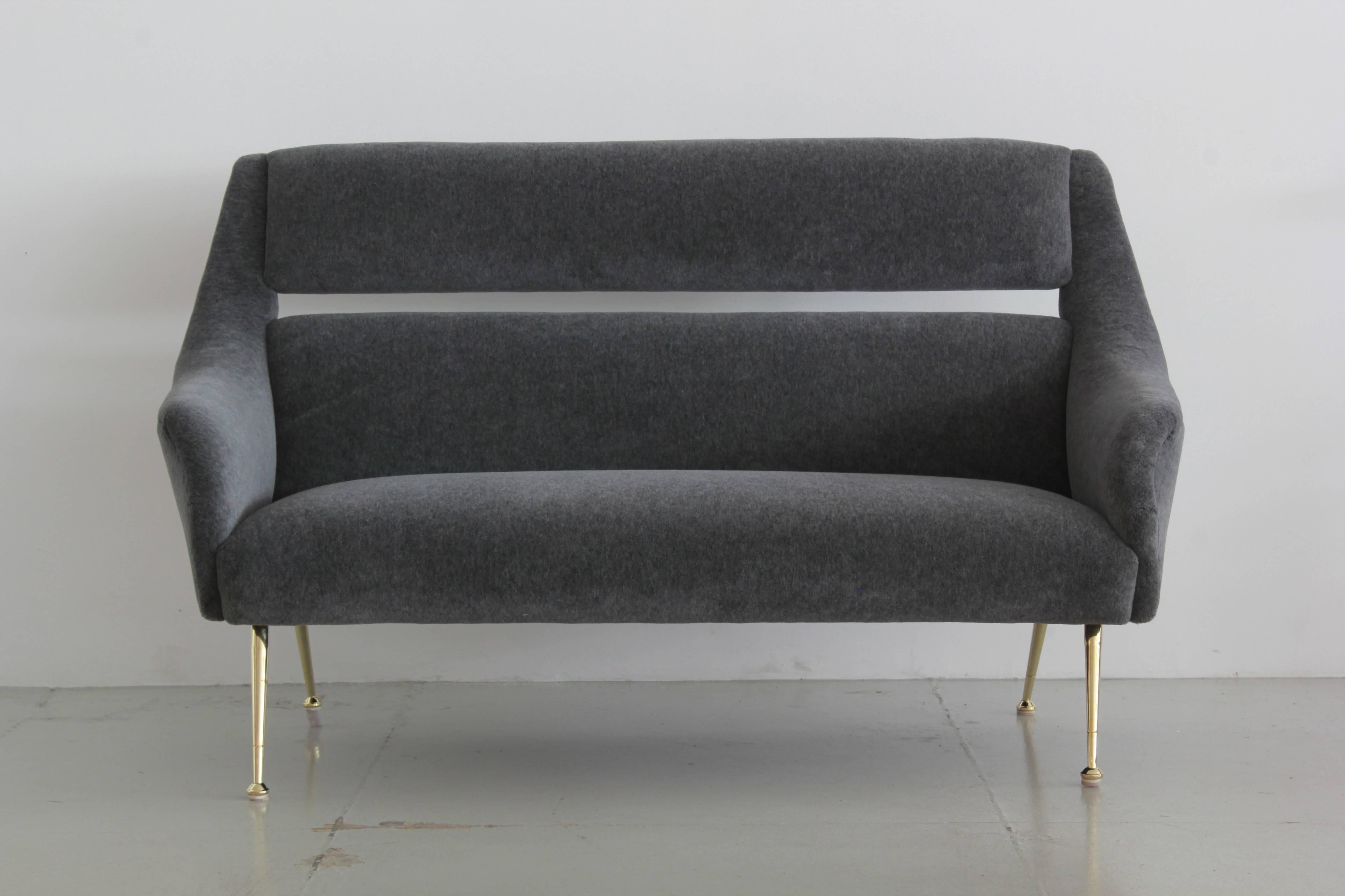 Gorgeous Italian settee newly upholstered in grey alpaca mohair. 
Cut out back with slender brass legs. 